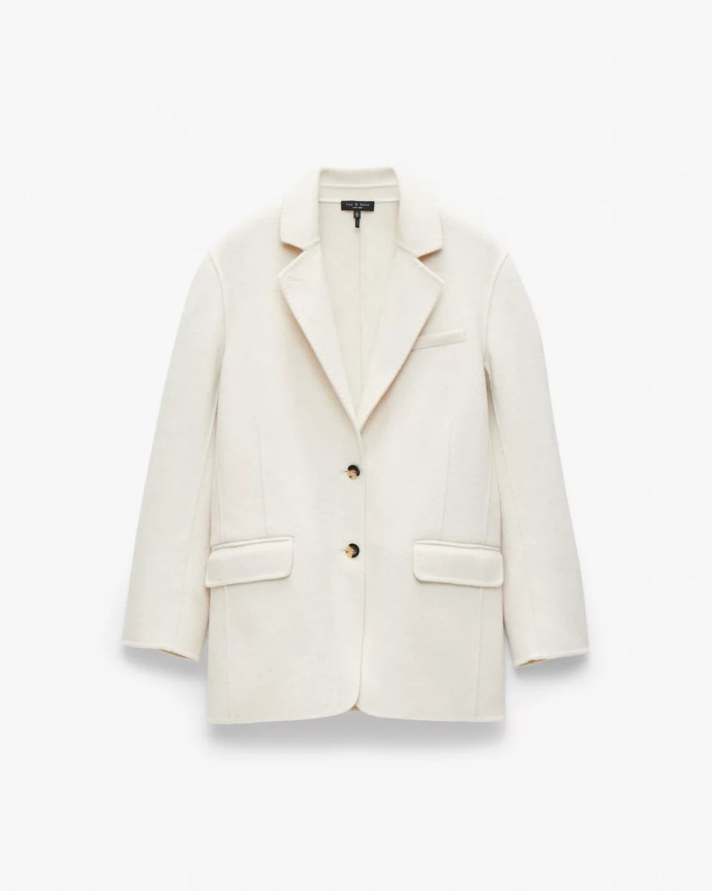 The Rag & Bone Zoe wool blazer is cream-colored with long sleeves, notch lapels, a relaxed fit, two black buttons, front flap pockets, and a chest pocket, shown against a plain white background.
