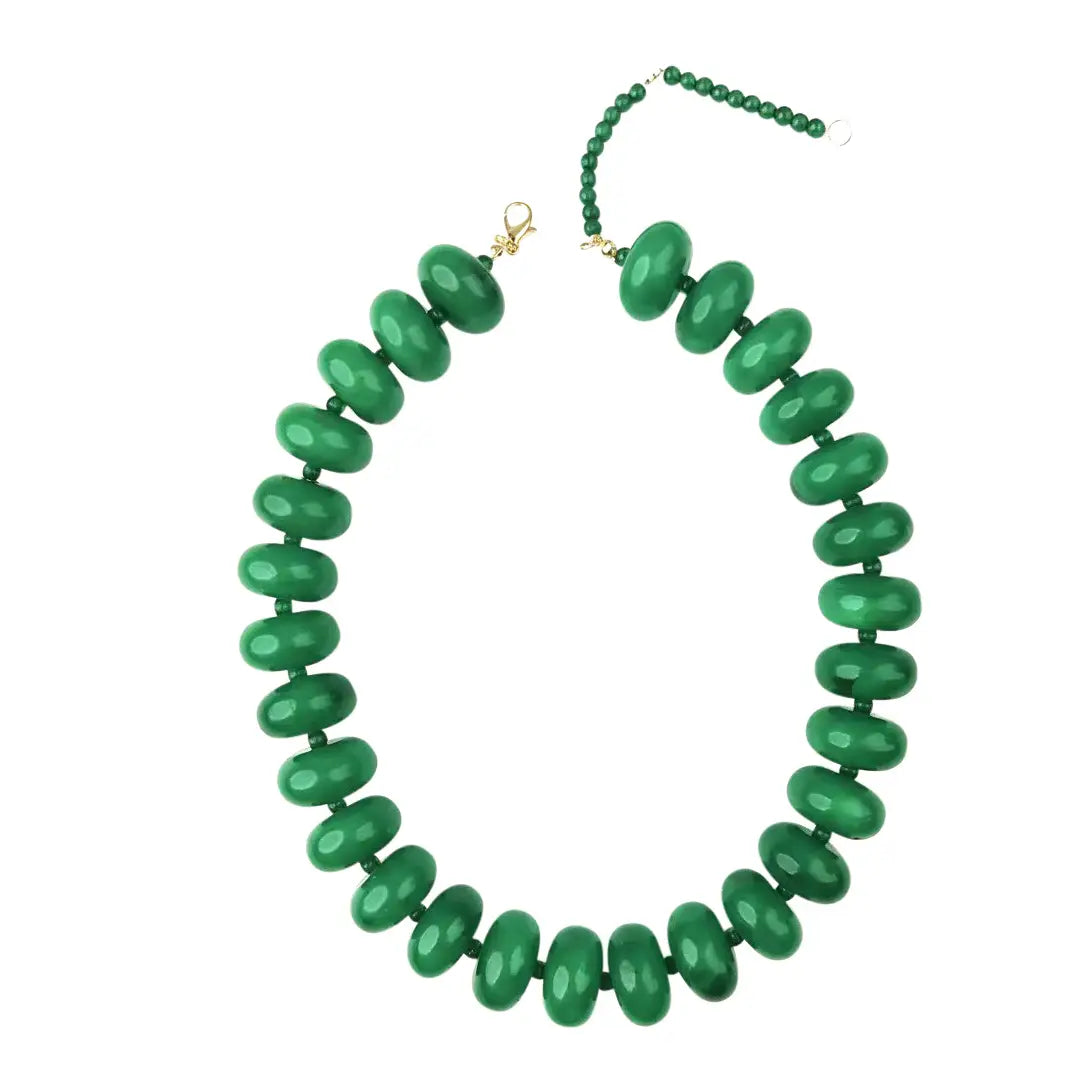 The Faire Bailey Chunky Beaded Necklace showcases large, glossy green marbled beads and an adjustable gold-tone clasp with chain extension, elegantly presented on a white background.