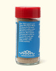A glass jar with a red lid contains Faire’s Woon Wok Legend's Seasoning Salt. The blue label suggests using it on rice, eggs, popcorn, chips, and soup, displays "woonkitchen.com," and shares a brief Master Wok Chef bio.