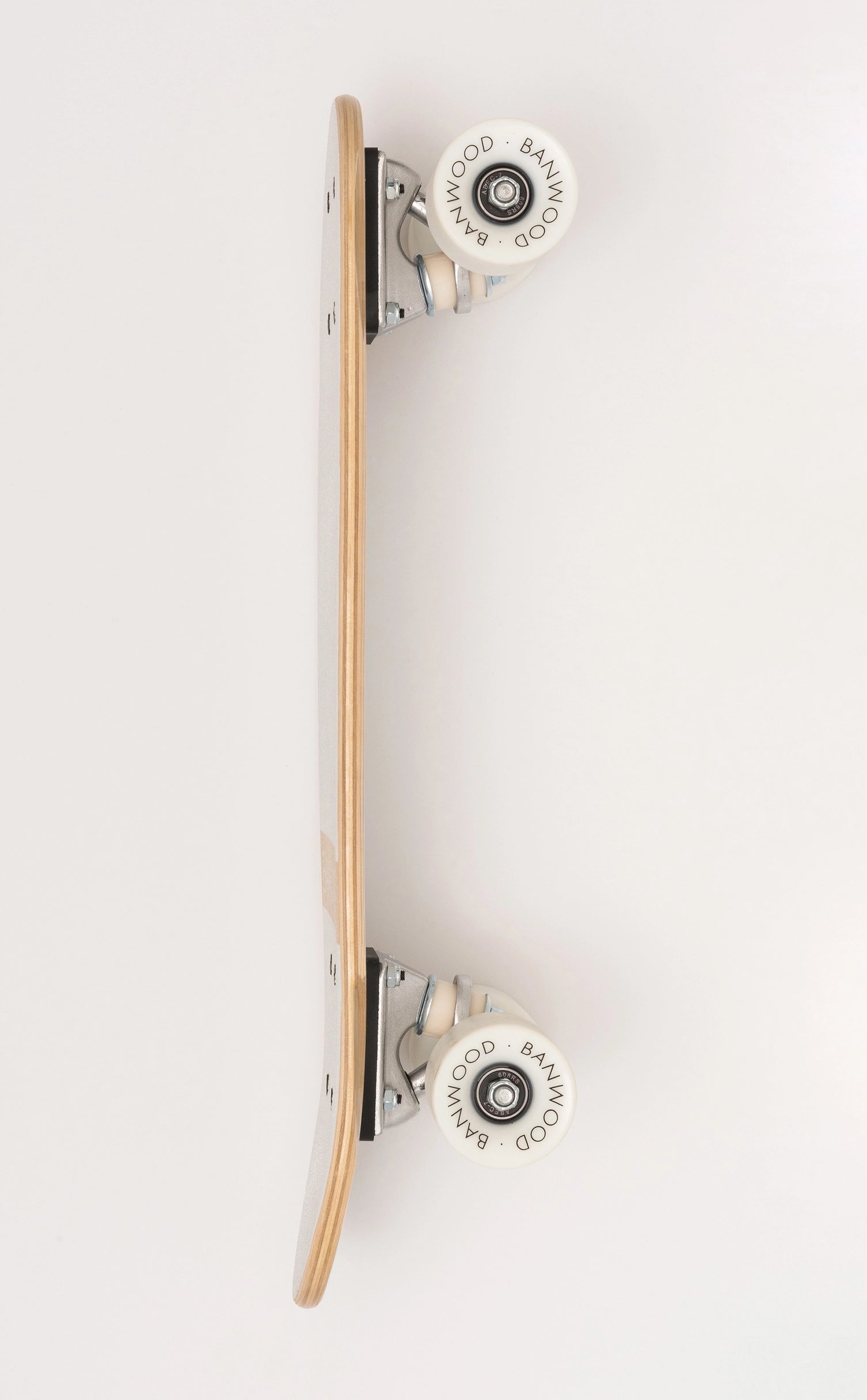 A Faire Vintage Skateboard is shown from the side on a white background, displaying the deck, trucks, and wheels. The sturdy Canadian maple deck ensures durability and a smooth ride.