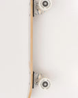 A Faire Vintage Skateboard is shown from the side on a white background, displaying the deck, trucks, and wheels. The sturdy Canadian maple deck ensures durability and a smooth ride.