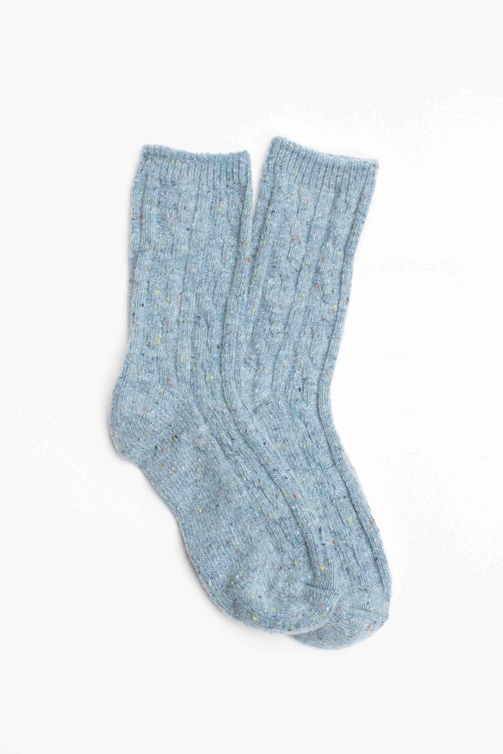 Faire Wool Speckled Knit Socks—light blue ribbed wool-blend socks with subtle multicolored speckles—shown flat on a white background.