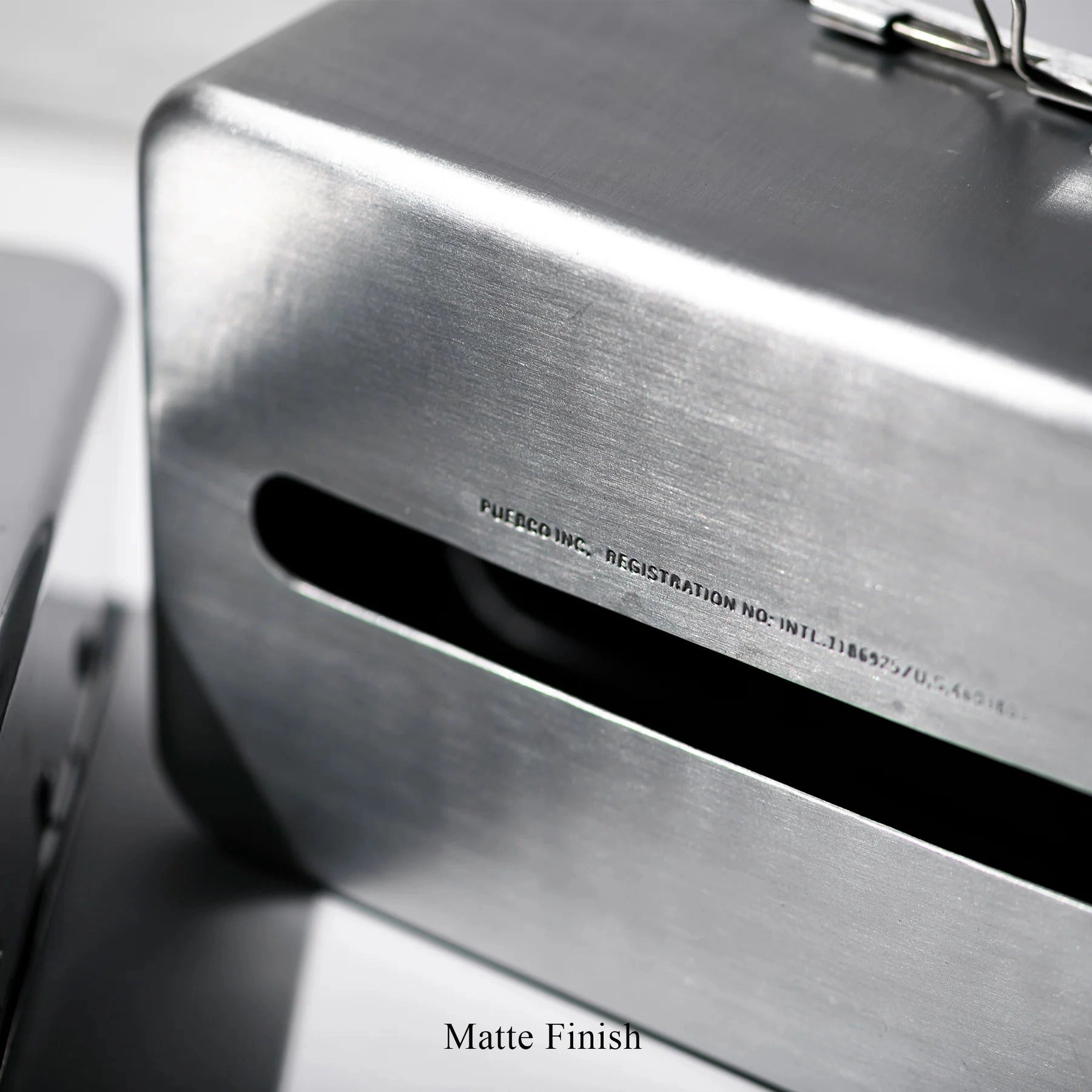 A close-up of the Faire Paper Towel Wall Case shows its aluminium body with a matte finish, a horizontal slot, and subtle registration details. "Matte Finish" is printed below this stylish storage container.