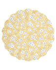 The Mixed Set Reusable Small Plates by Faire features round scalloped edges, a yellow background, and a white floral pattern with small flowers and leaves inspired by Liberty print plates.