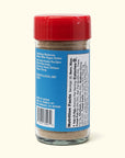 A glass spice jar with a red lid and blue label lists ingredients, storage tips, and nutrition facts. Inside is Faire’s Woon Wok Legend's Seasoning Salt—a fine beige blend perfect for adding bold flavor to your favorite dishes.