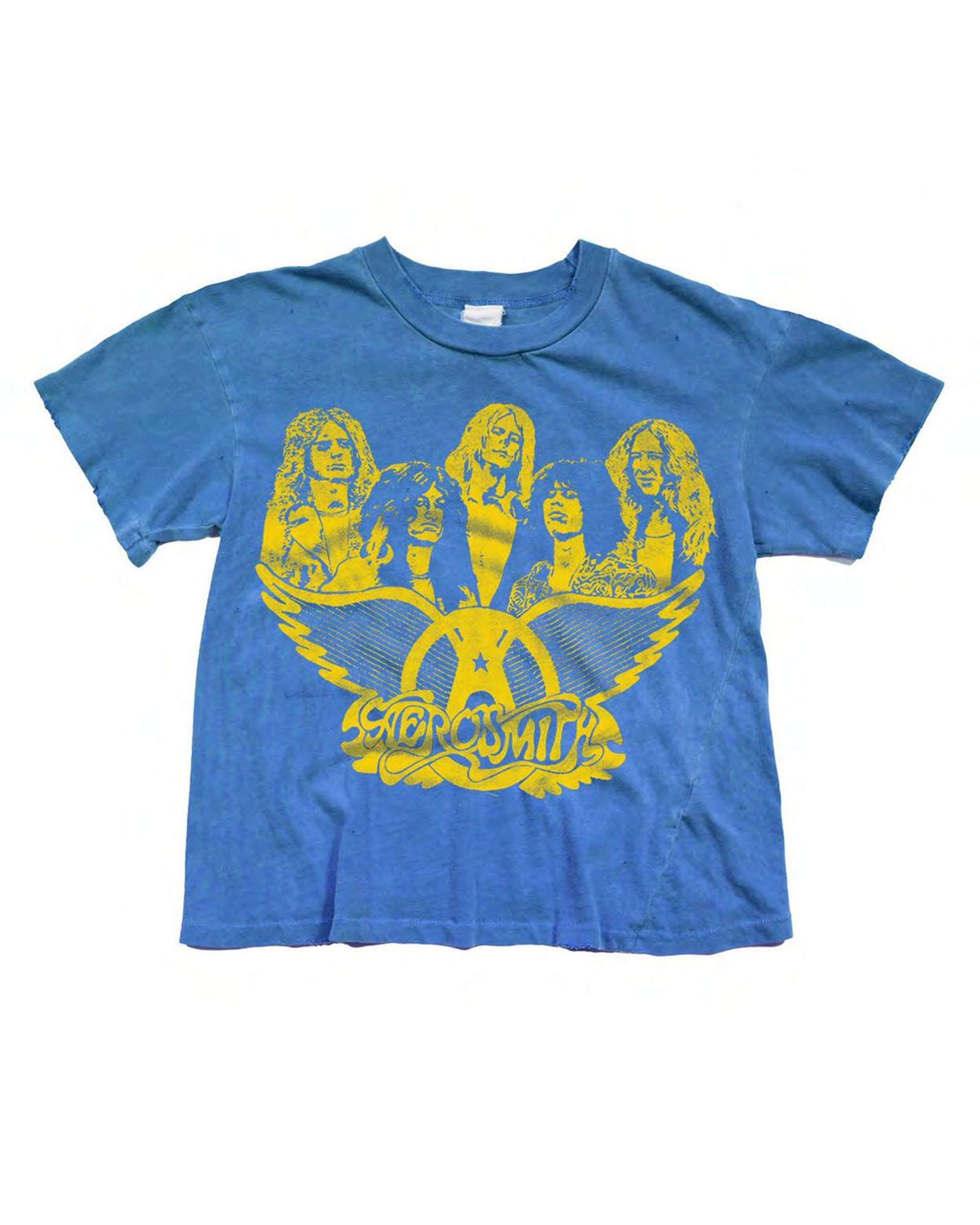 The Made Worn Aerosmith Crop Tee features a blue design with a yellow graphic of five people above the classic winged logo, giving this vintage-inspired top standout appeal for music fans.