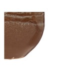 Close-up of the Creative Co-op Stoneware Planter, featuring a brown, slightly glossy textured surface with horizontal lighter bands near the top, set against a white background.
