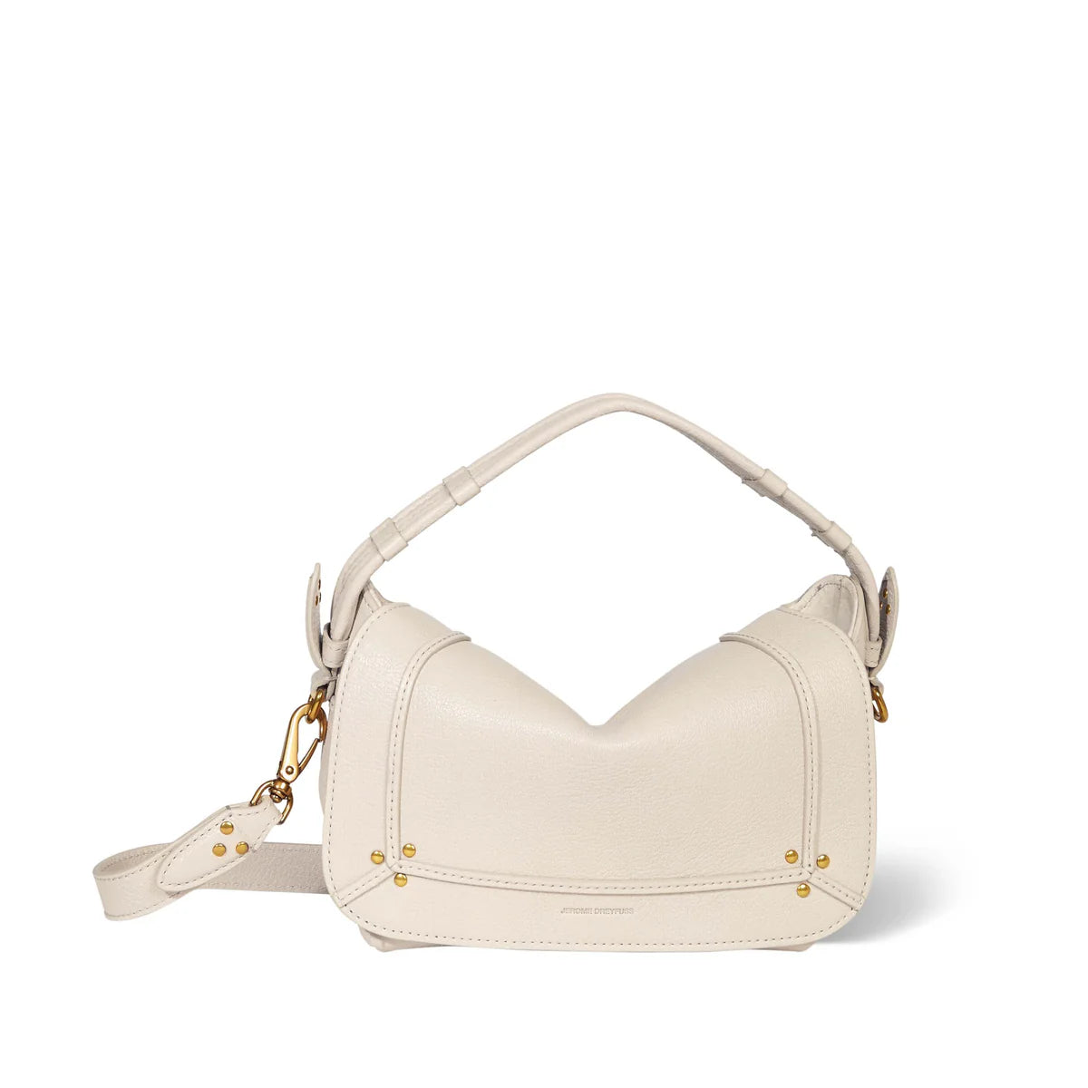 The Pepito Small Bag by Jerome Dreyfuss is a cream quilted leather shoulder bag with a curved top and short handle. It features gold-tone hardware, a detachable strap, and is elegantly crafted in Italy against a white backdrop.