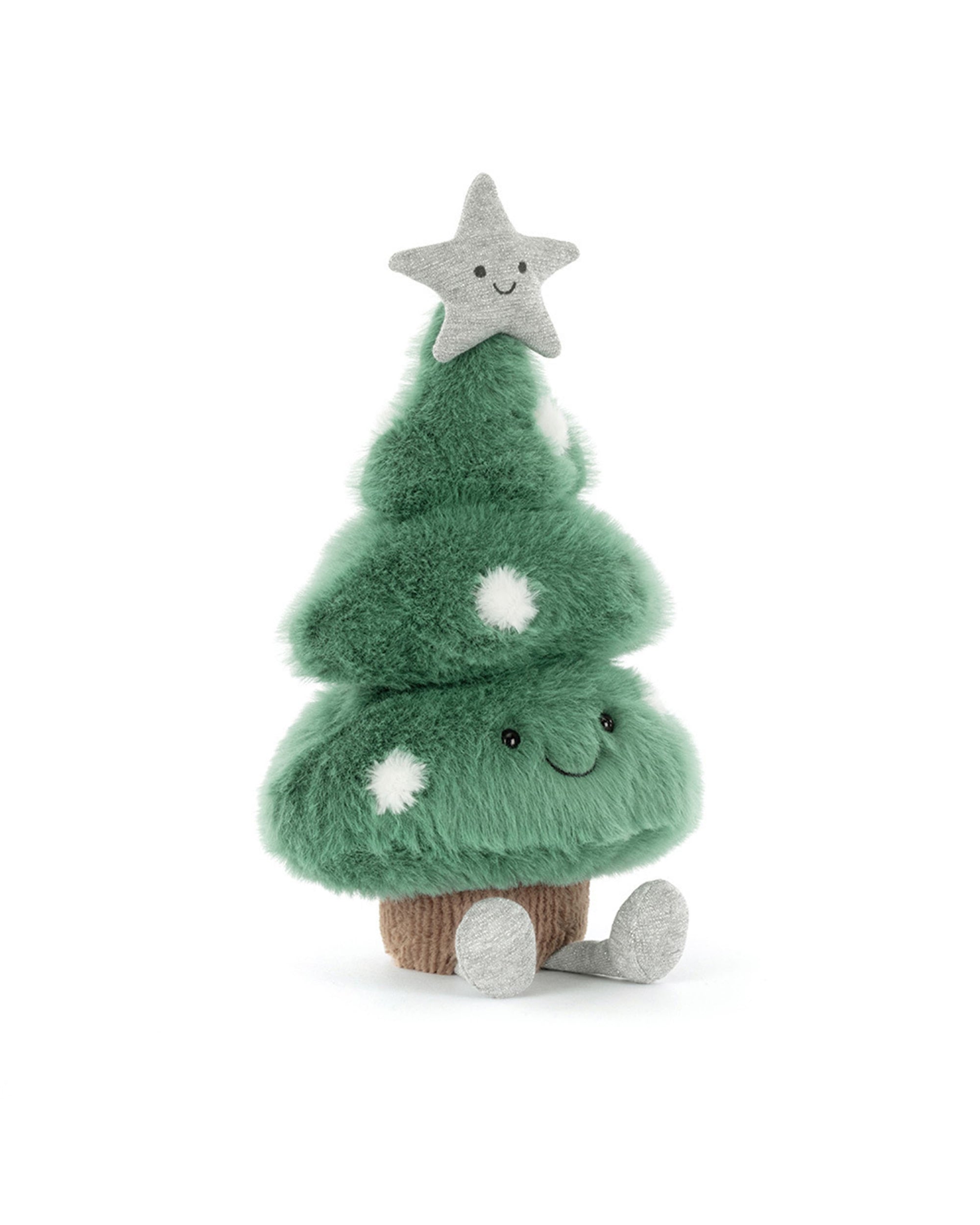 The Amuseables Christmas Tree by Jelly Cat Inc. is a green plush with white spots, a smiling face, grey feet, and a grey star on top, sitting on a brown base—perfect for festive décor.