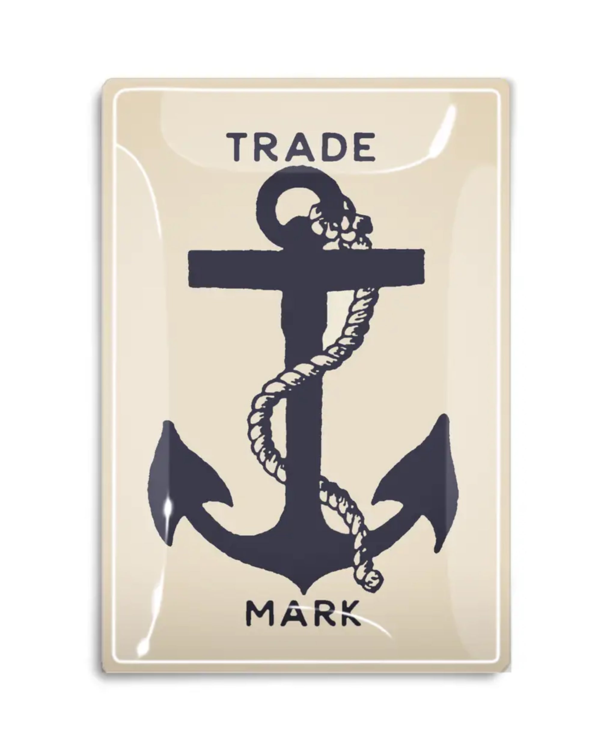 The Faire Shipman's Anchor Glass Tray is a beige rectangular piece featuring a bold black anchor with a coiled rope, “TRADE” above and “MARK” below in black capitals, evoking nautical charm.