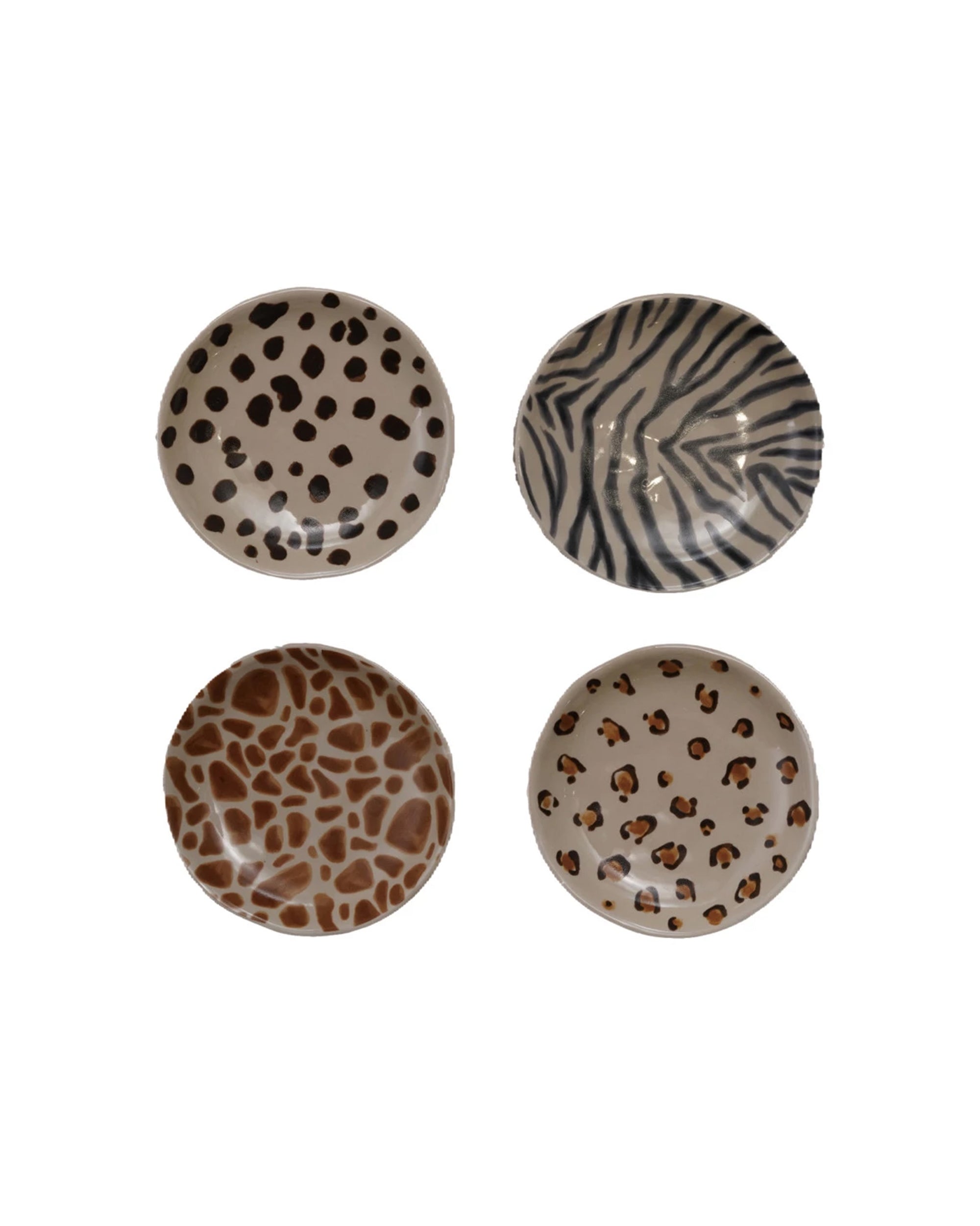Four Creative Co-op "Dish with Animal Print" stoneware bowls—featuring spots, zebra stripes, giraffe, and leopard prints—are arranged in a square on a white background. Durable and stylish; dimensions available on request.