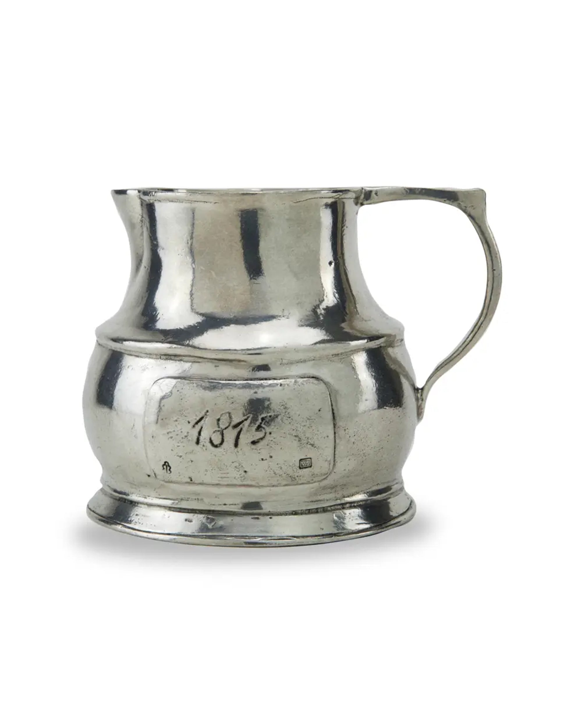 The Faire Vintage 1815 Large Pitcher features a single handle, wide base, and an "1815" engraved plaque. Its slightly uneven surface showcases Italian handcrafted charm, embodying the elegance of a classic vintage piece.
