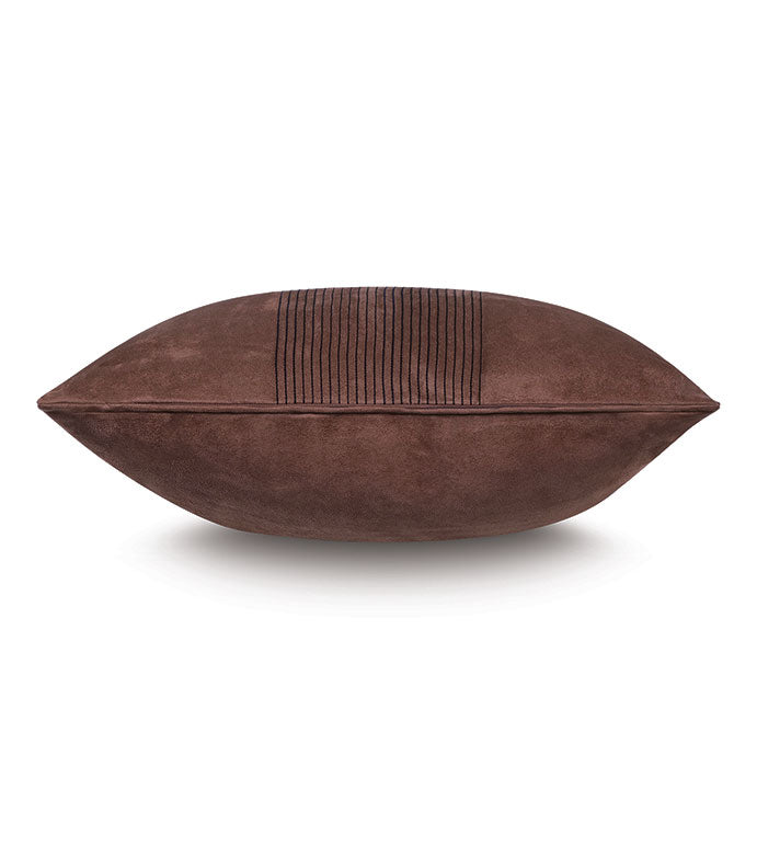 A side view of the ROCCO FAUX SUEDE pillow by Eastern Accents, featuring chestnut vegan suede, a horizontal striped textured panel, and black chain-stitching in the center against a white background.