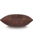 A side view of the ROCCO FAUX SUEDE pillow by Eastern Accents, featuring chestnut vegan suede, a horizontal striped textured panel, and black chain-stitching in the center against a white background.