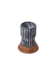The Accent Decor 51895 Argon Candleholder is a small ceramic piece with a flared base, brown at the bottom and ribbed blue on the upper section, displayed against a white background.
