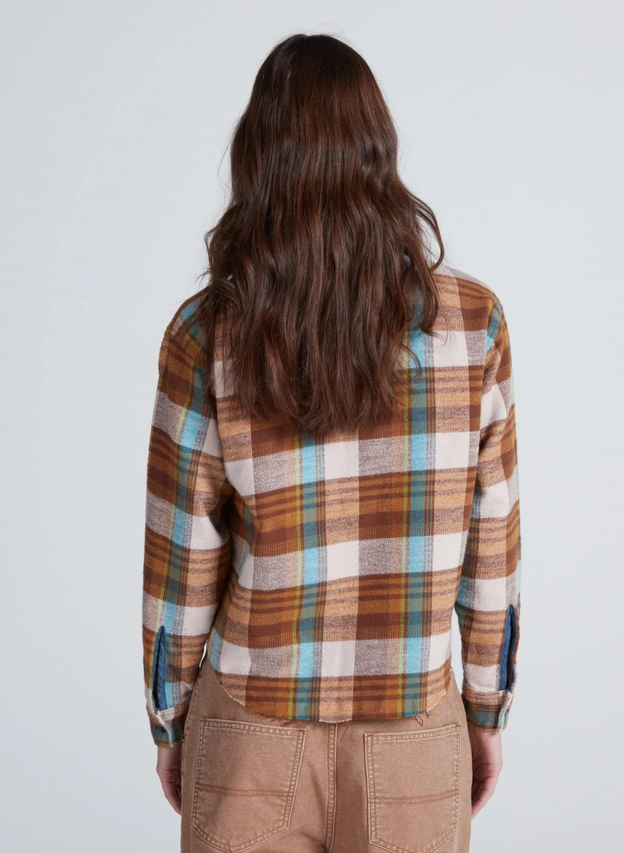 ASKK Crosby Flannel in pink plaid, shown from behind, styled with tan pants. Casual look by Bungalow Furniture &amp; Accessories.