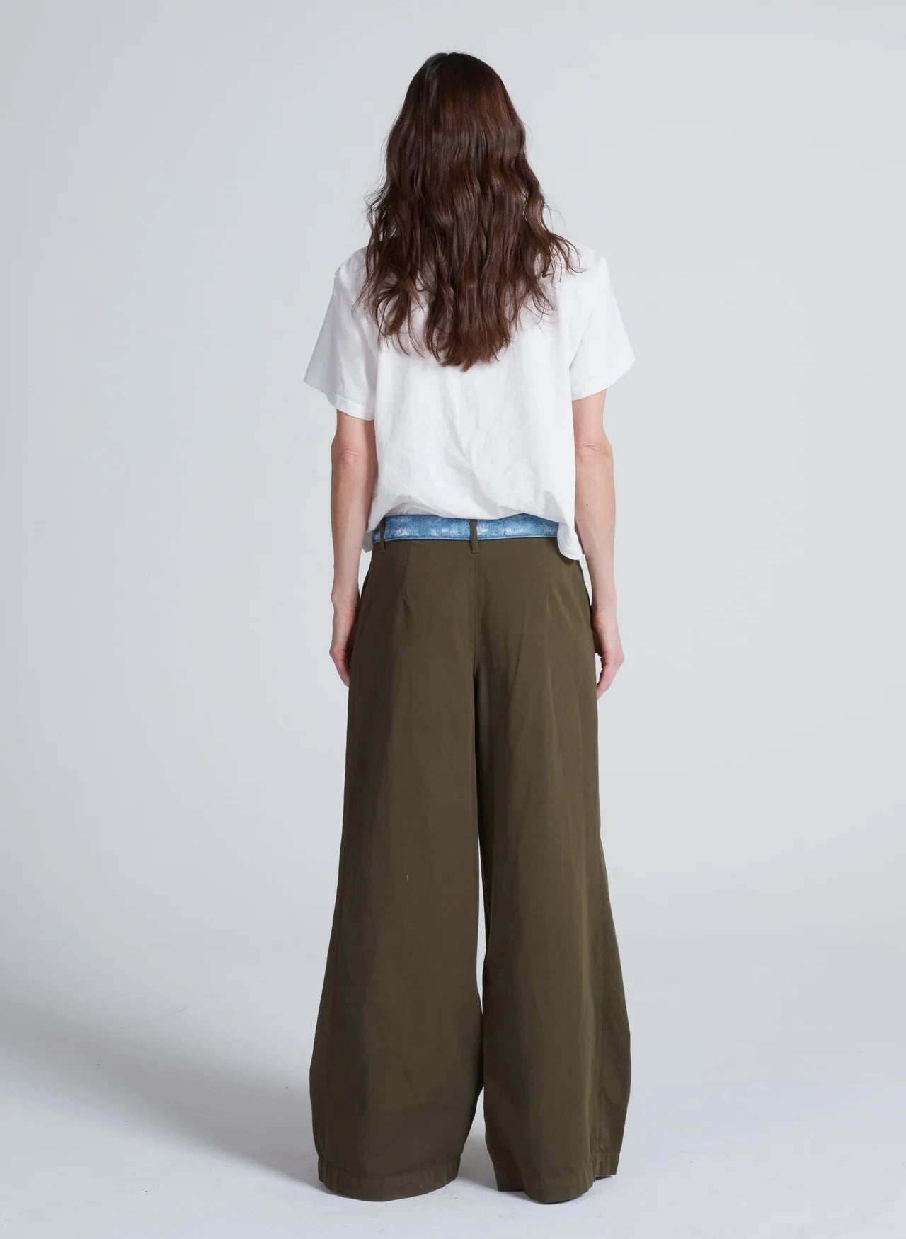 ASKK Greenwich Pant in white, shown from the back, styled with a white tee against a plain background.