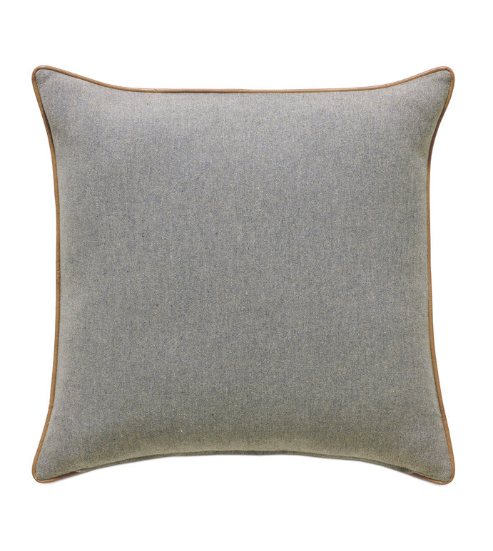 The Magnus Steel w/welt pillow by Eastern Accents is a square gray cushion with subtle texture, brown piping at the edges, and a zipper closure, displayed against a white background.