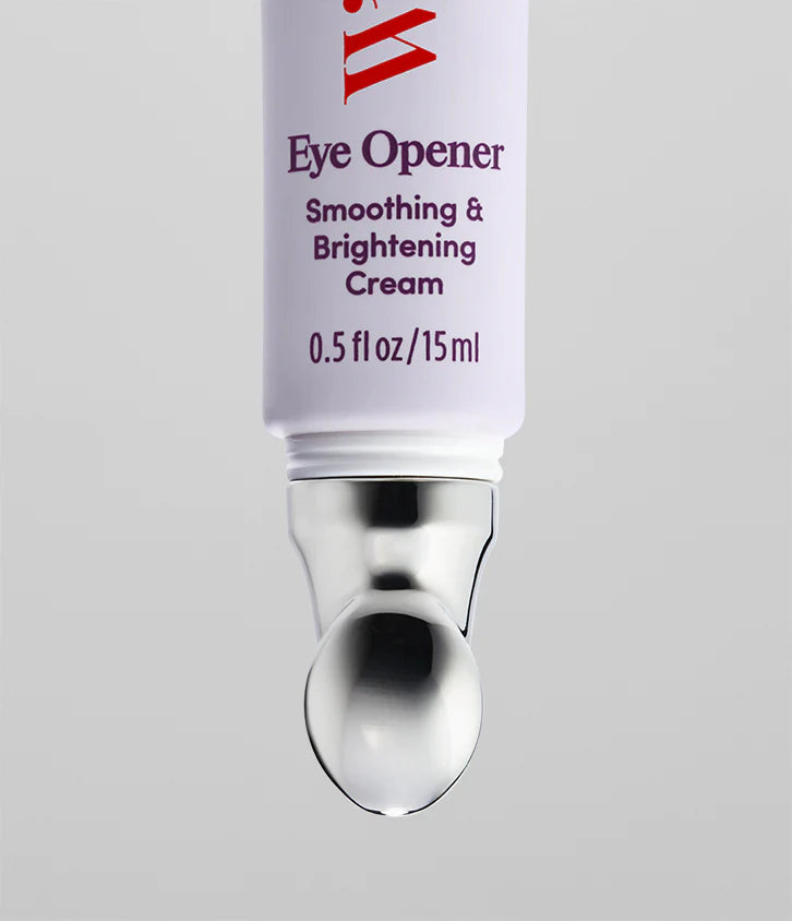 A close-up of a Faire Eye Opener - Smoothing & Brightening Cream tube (0.5 fl oz/15 ml) for dark circles and puffiness, with a metallic applicator tip, set against a plain light gray background.