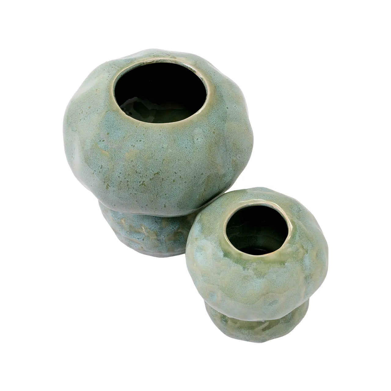 The Import Collection’s Connolly Vases—two round, handcrafted ceramics with wide openings and a muted green glaze—bring modern organic style to any space. Shown side by side on a white background.