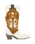 Product Description: The MME Napkin by Faire features an illustration of a cowboy boot with a white base and a brown upper section embellished with white star and scroll designs.