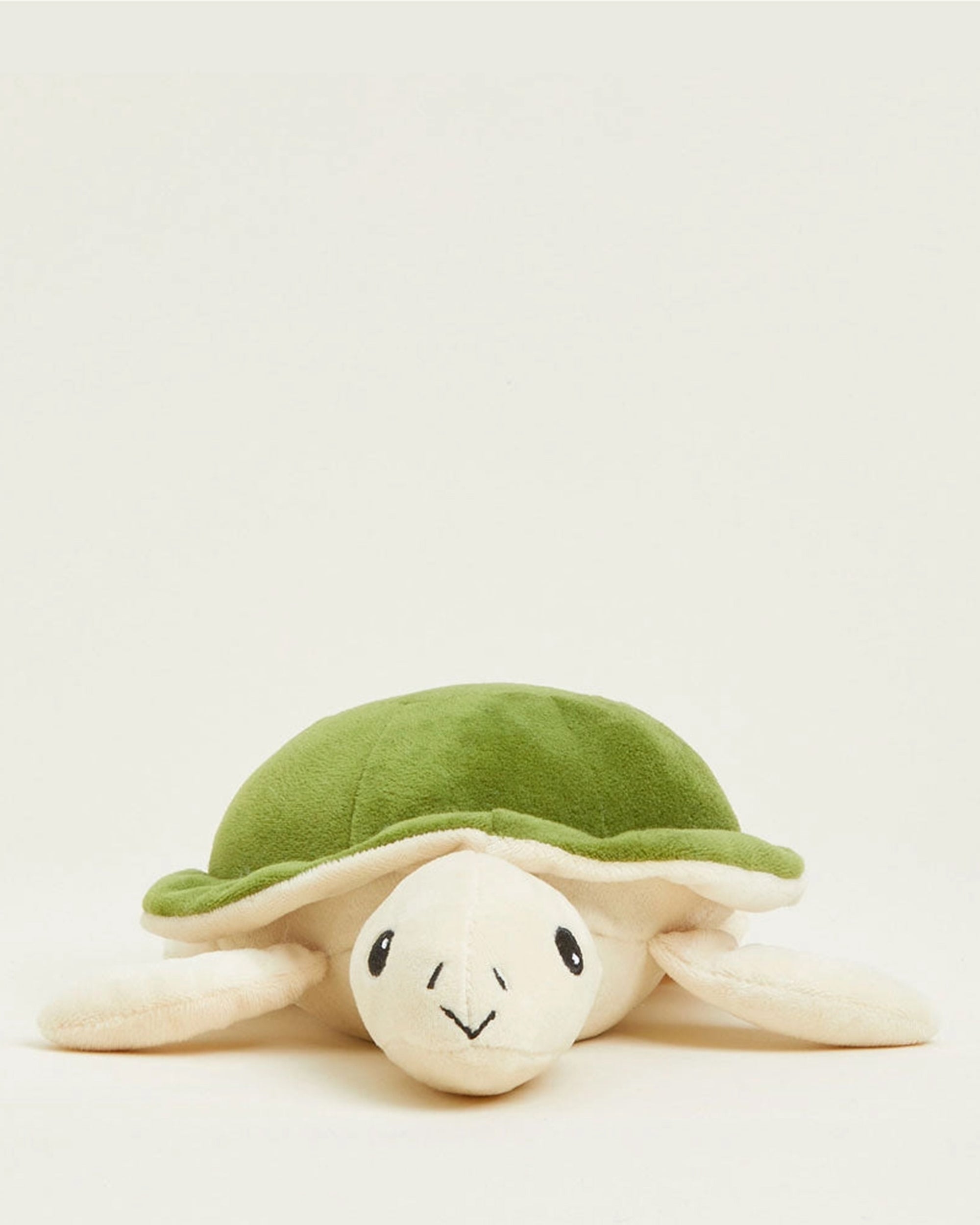 The Faire Turtle Warmies Junior is a soft, microwavable plush turtle with a green shell and cream-colored body—perfect as a comforting sensory toy for warmth and relaxation.