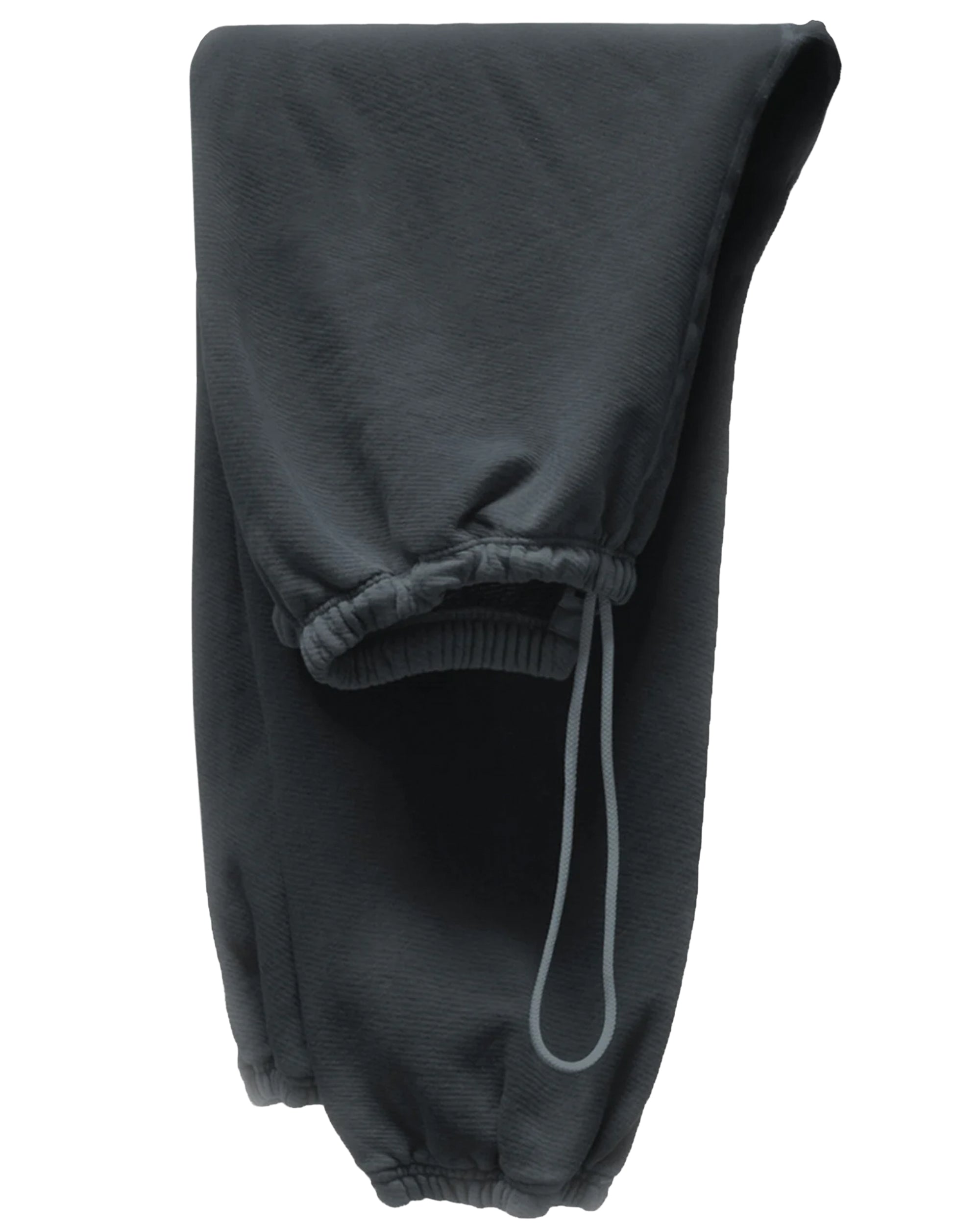 A pair of BASIC GOODNESS OG SWEATPANTS by Free City (sparrow, LLC) in dark gray French terry, featuring elastic cuffs and a visible drawstring, is neatly folded on a white background.