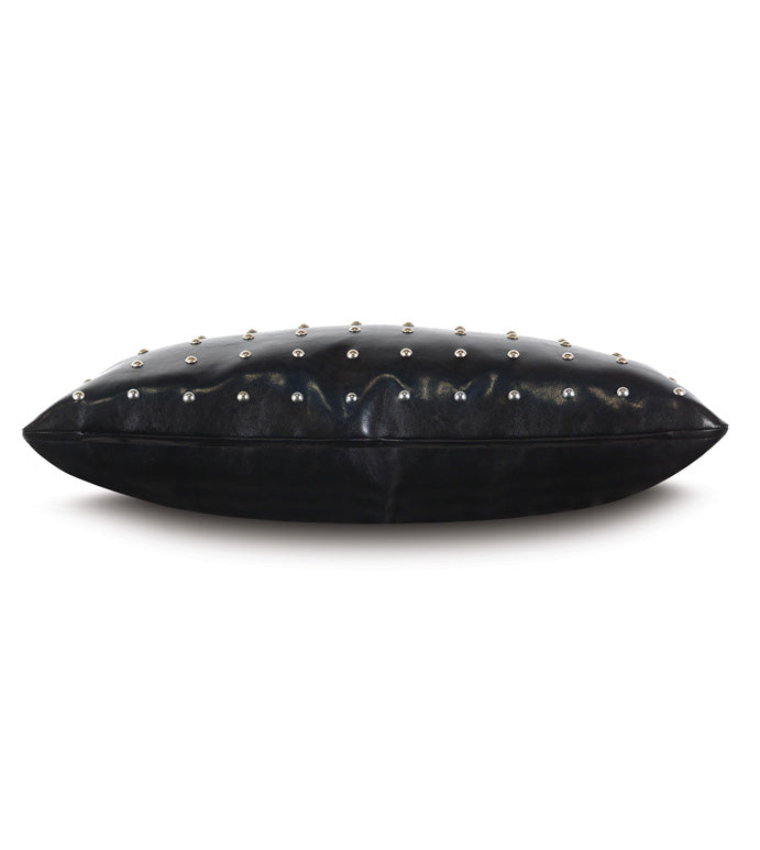 The Eastern Accents NAILHEAD DECO pillow is a black rectangular faux leather accent with a shiny finish and evenly spaced silver nailhead details on top, shown from the side against a white background.