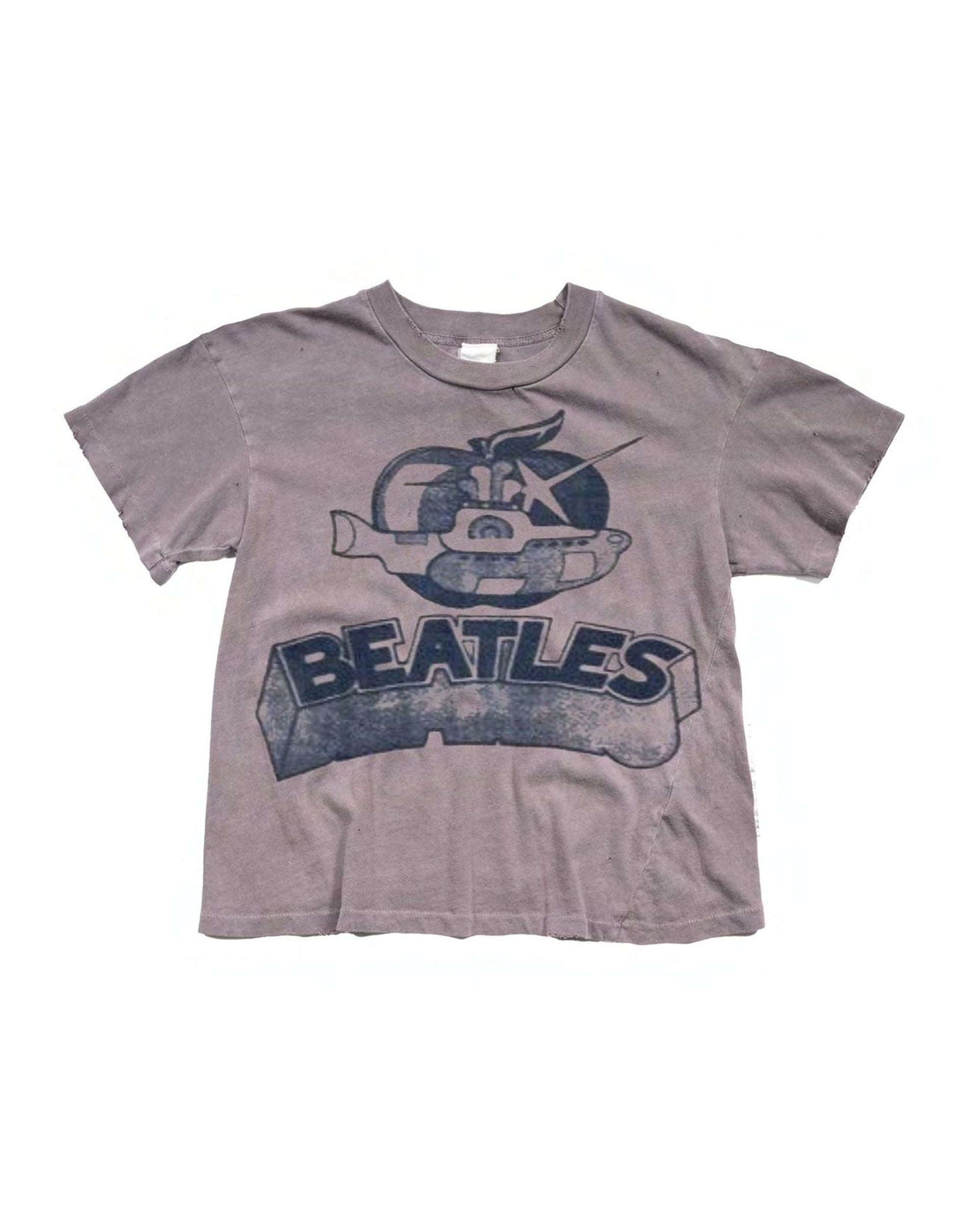 The Beatles Crop Tee by Made Worn is a faded gray crop top featuring a cartoon submarine and “BEATLES” in bold letters—a stylish musical tribute to the iconic band’s "Yellow Submarine.