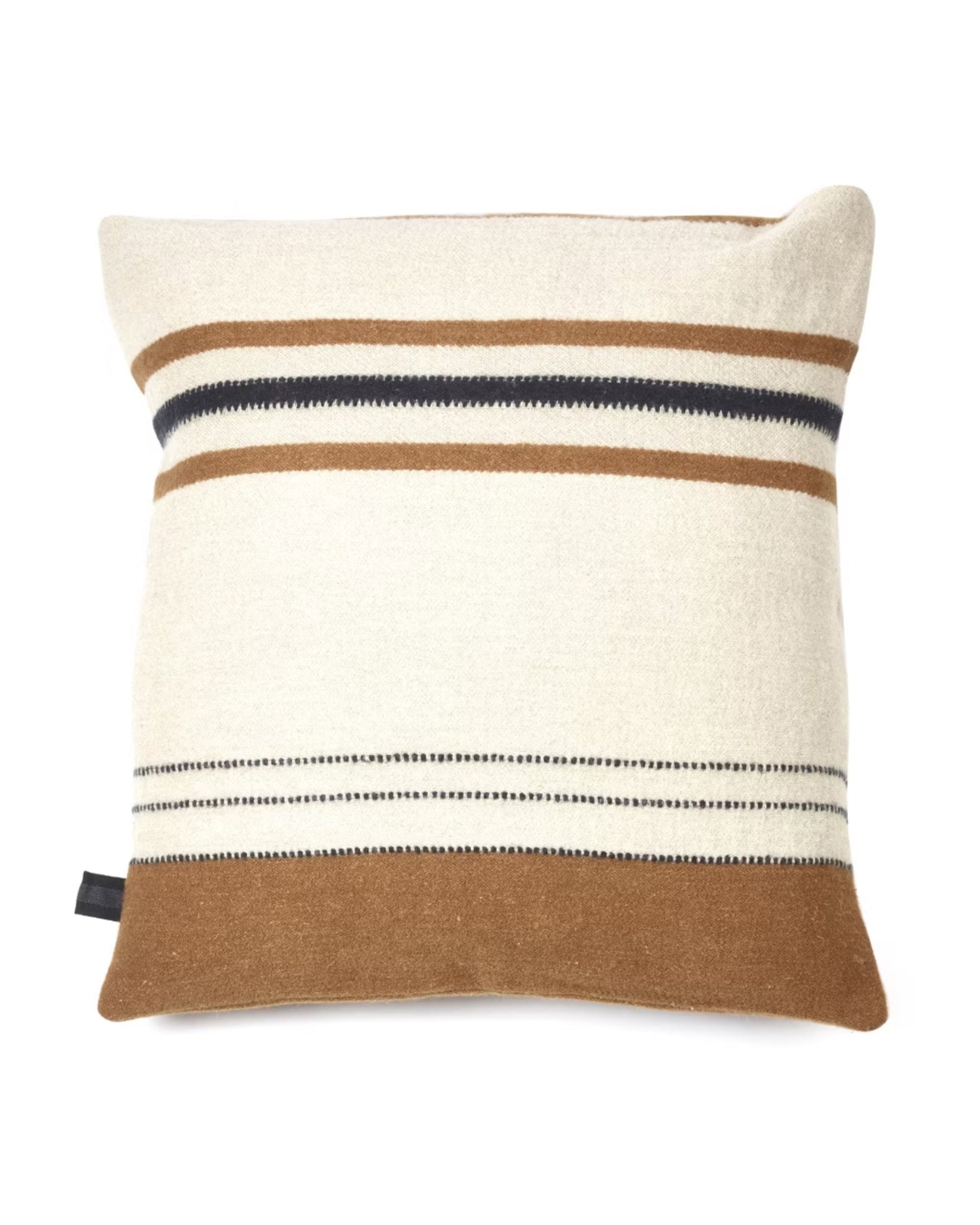 The Foundry Pillow by Libeco Home is a square cushion with a neutral cream artisanal linen cover, accented by horizontal brown, black, and beige stripes of varying widths and finished with a small black side tag.