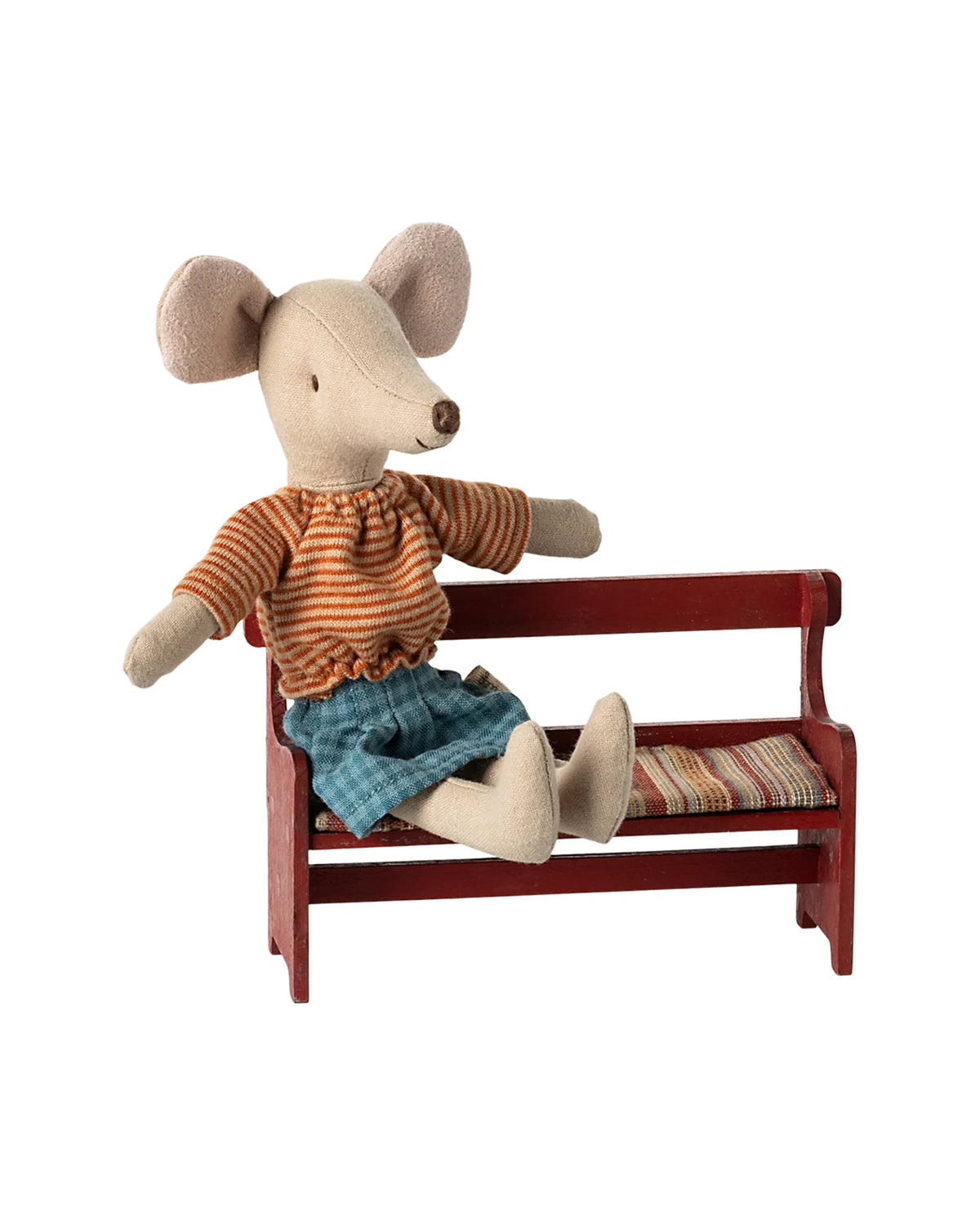 Maileg Mouse in striped shirt and blue skirt seated on red bench, Maileg, playful decor for kids’ rooms.