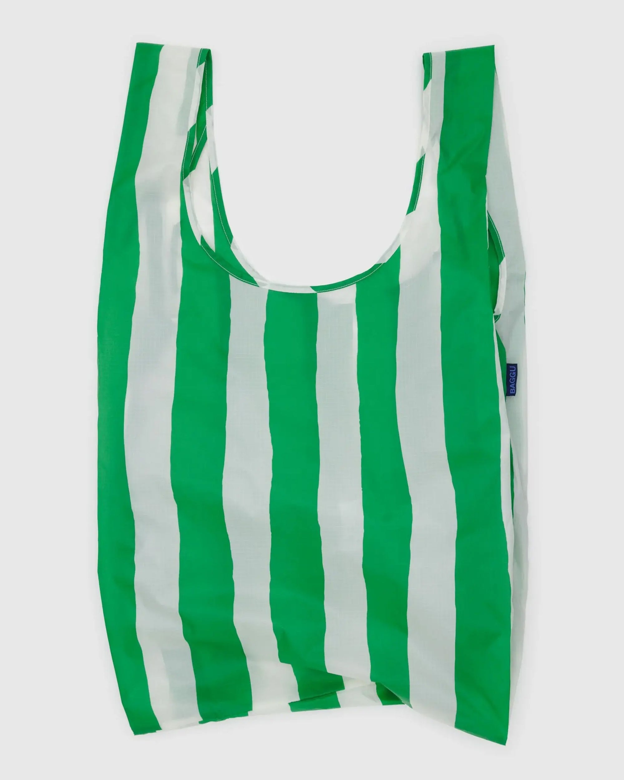 The Big Baggu by Baggu is a slouchy carry-all shopping bag with vertical green and white stripes, crafted from recycled ripstop nylon and displayed against a plain white background.