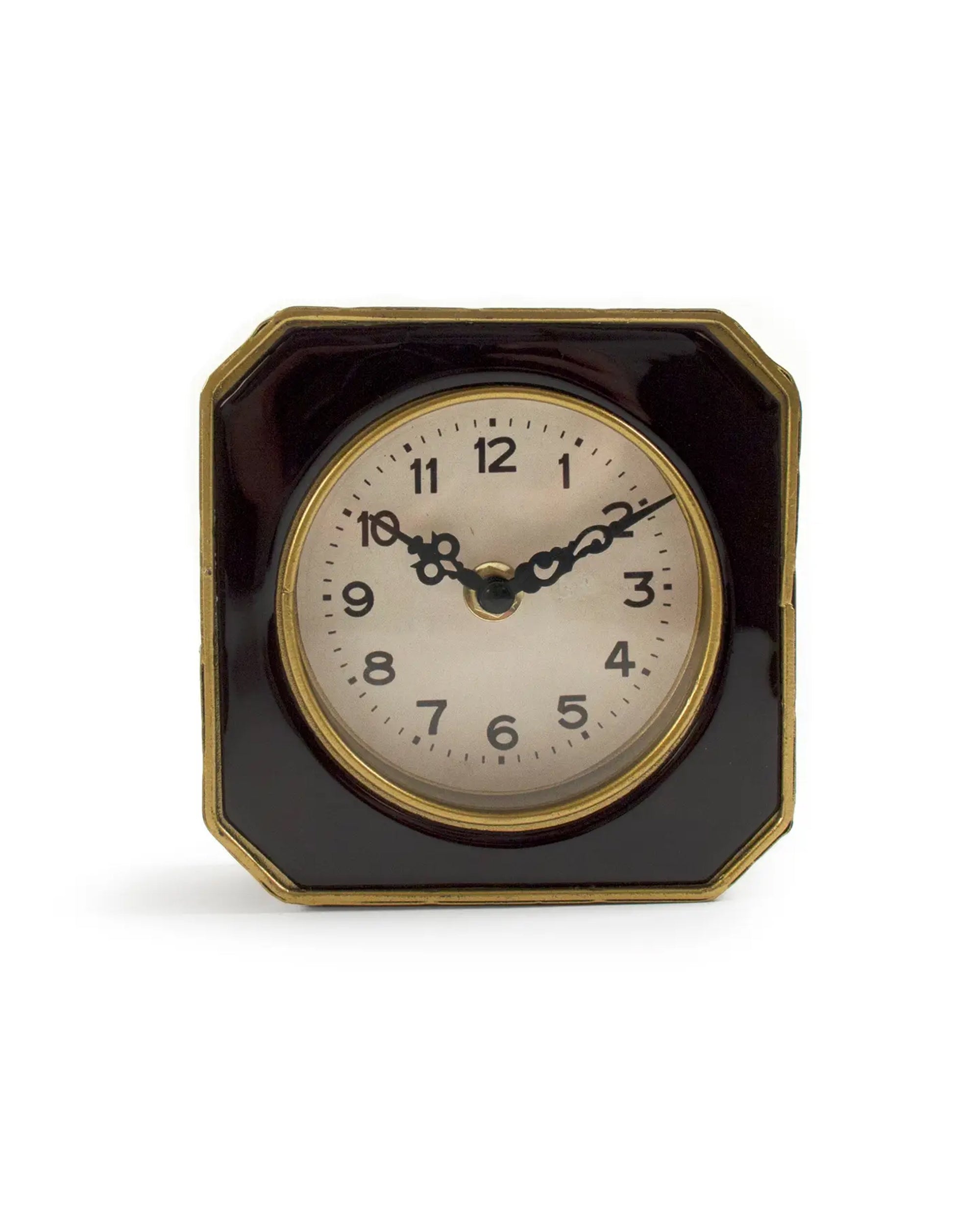 The Zentique Black and Gold Clock is a vintage square table clock with a dark glossy frame, gold accents, black Arabic numerals, and ornate black hands—an elegant décor piece displaying the time as 10:10.