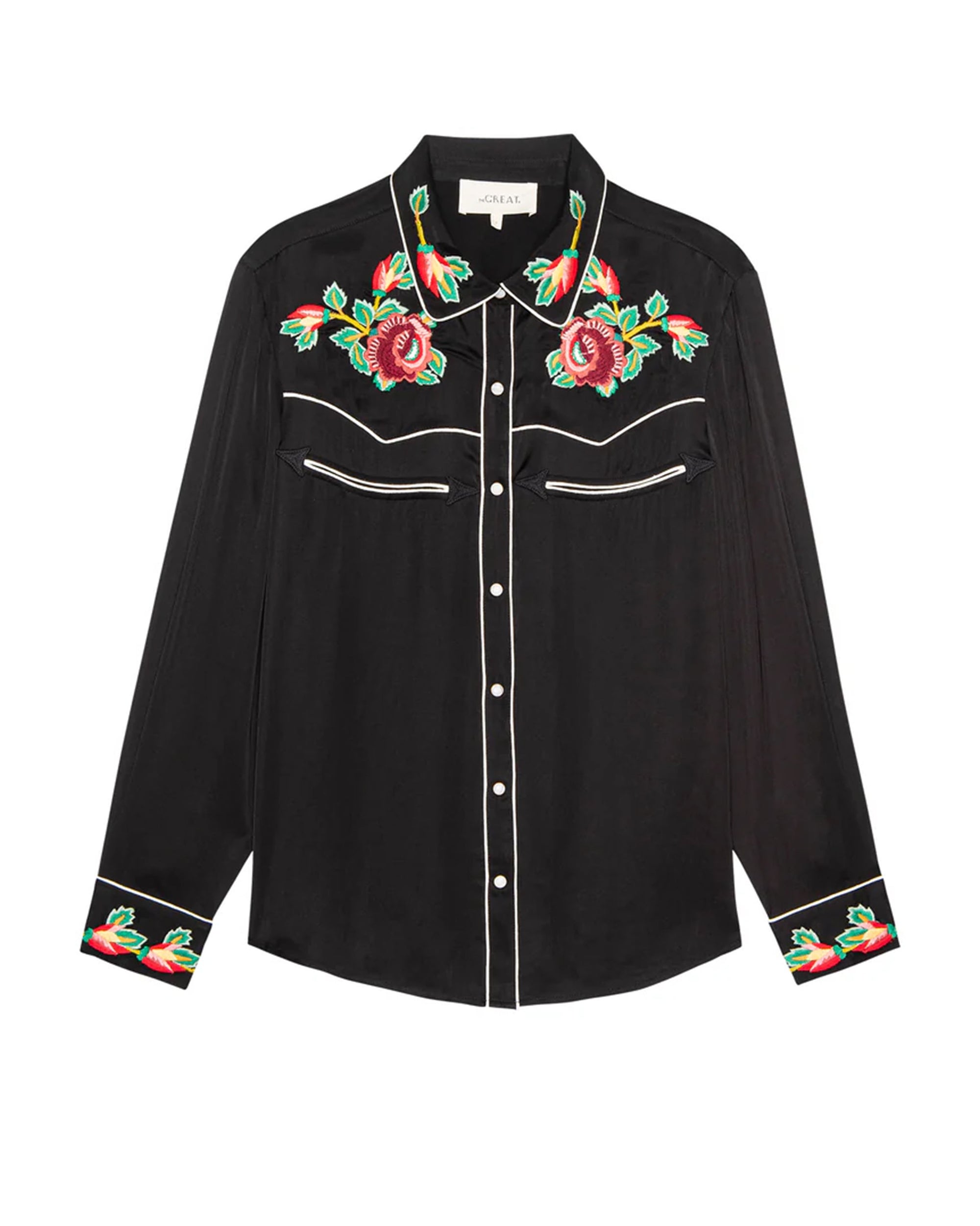 The Great Inc.'s Heirloom Rose Western Shirt is a black long-sleeve with white piping, pearl snap buttons, and embroidered roses on the chest and cuffs.