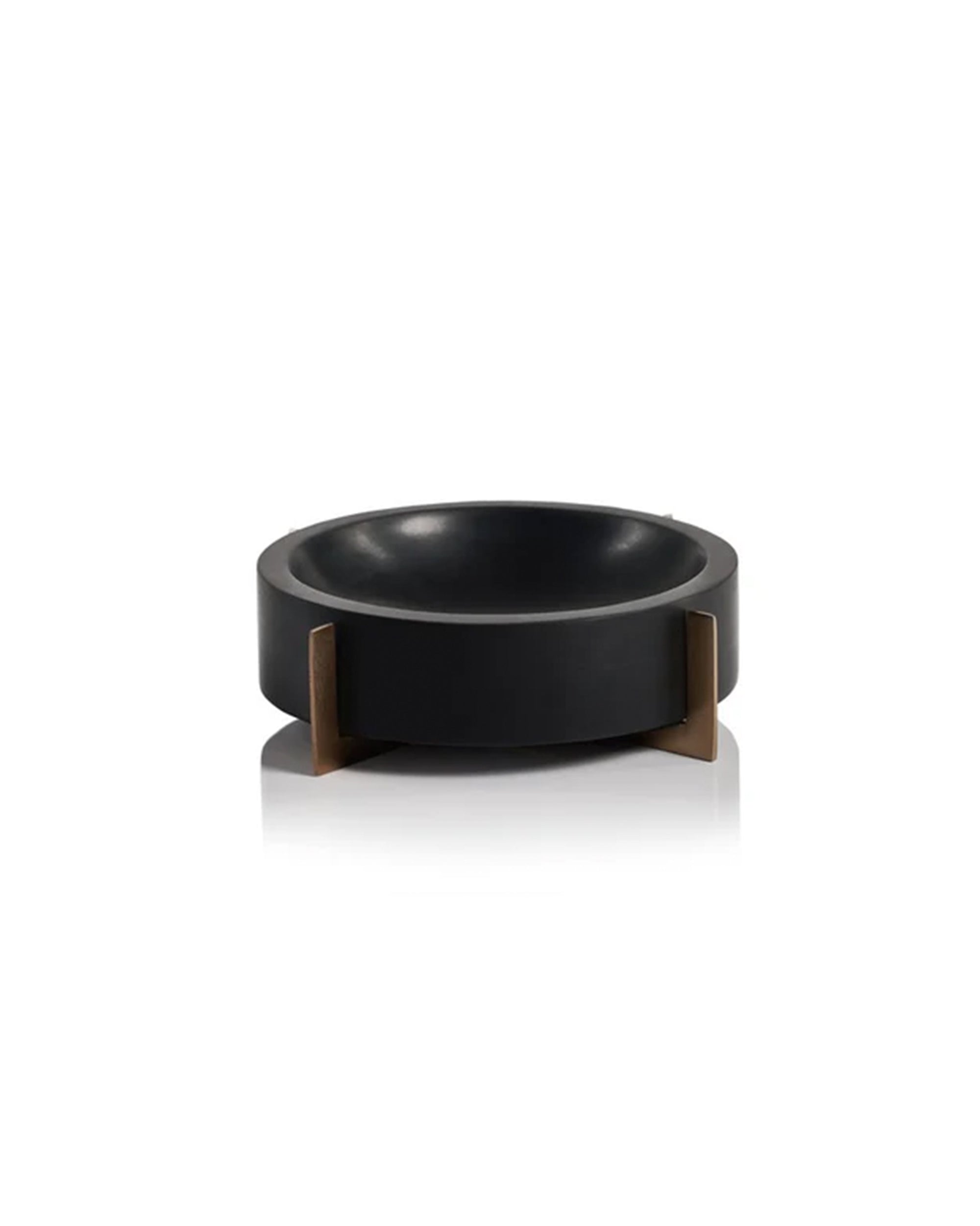 The Zodax IN-7369 Black Marble Bowl features a round, matte black design with thick sides, supported by four short gold metal legs and displayed on a white background.
