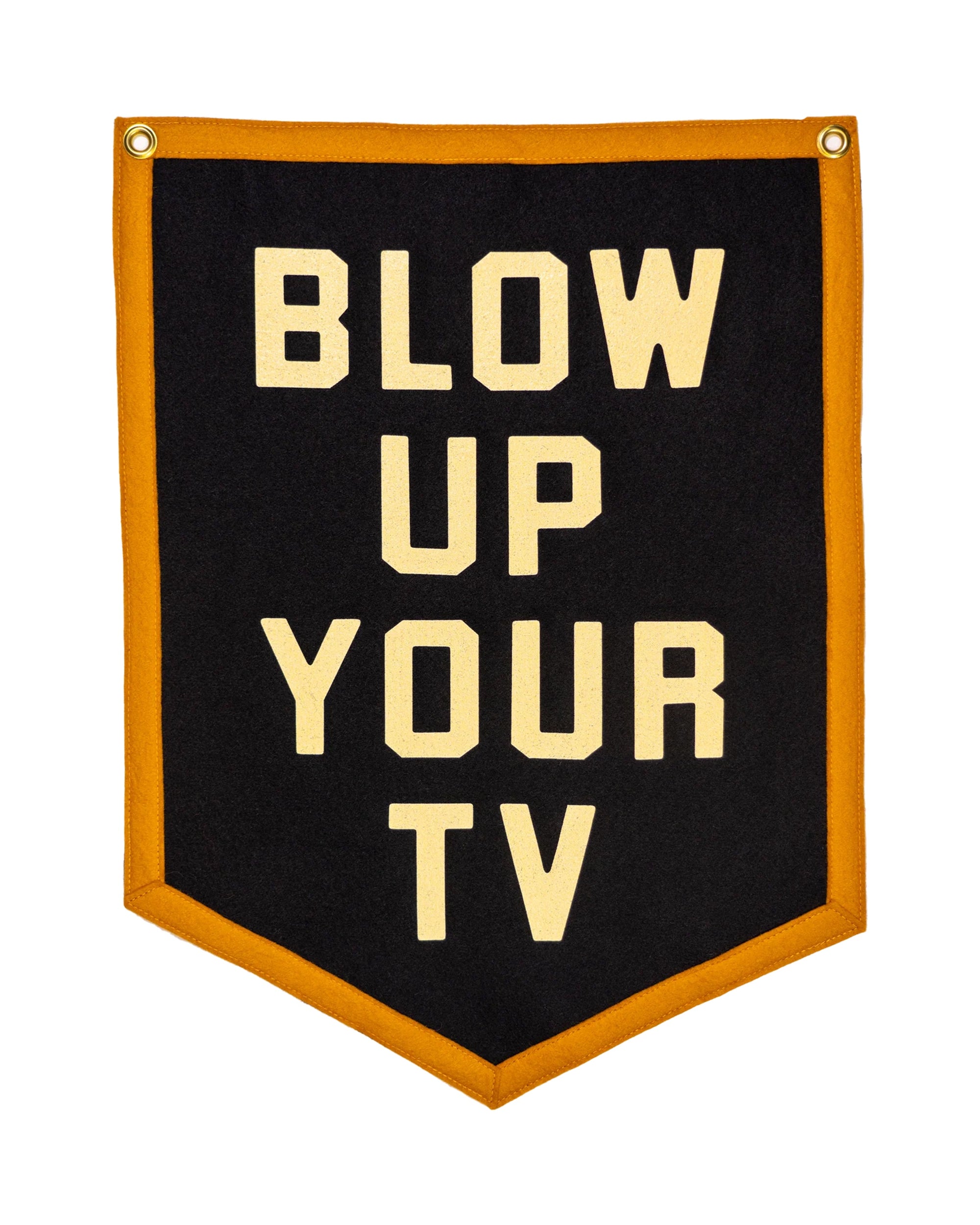 The Blow Up Your TV Pennant 18x24 by Oxford Pennant features bold cream letters on black, golden yellow trim, and “BLOW UP YOUR TV” text inspired by the Spanish Pipedream. Includes two metal grommets for easy hanging.