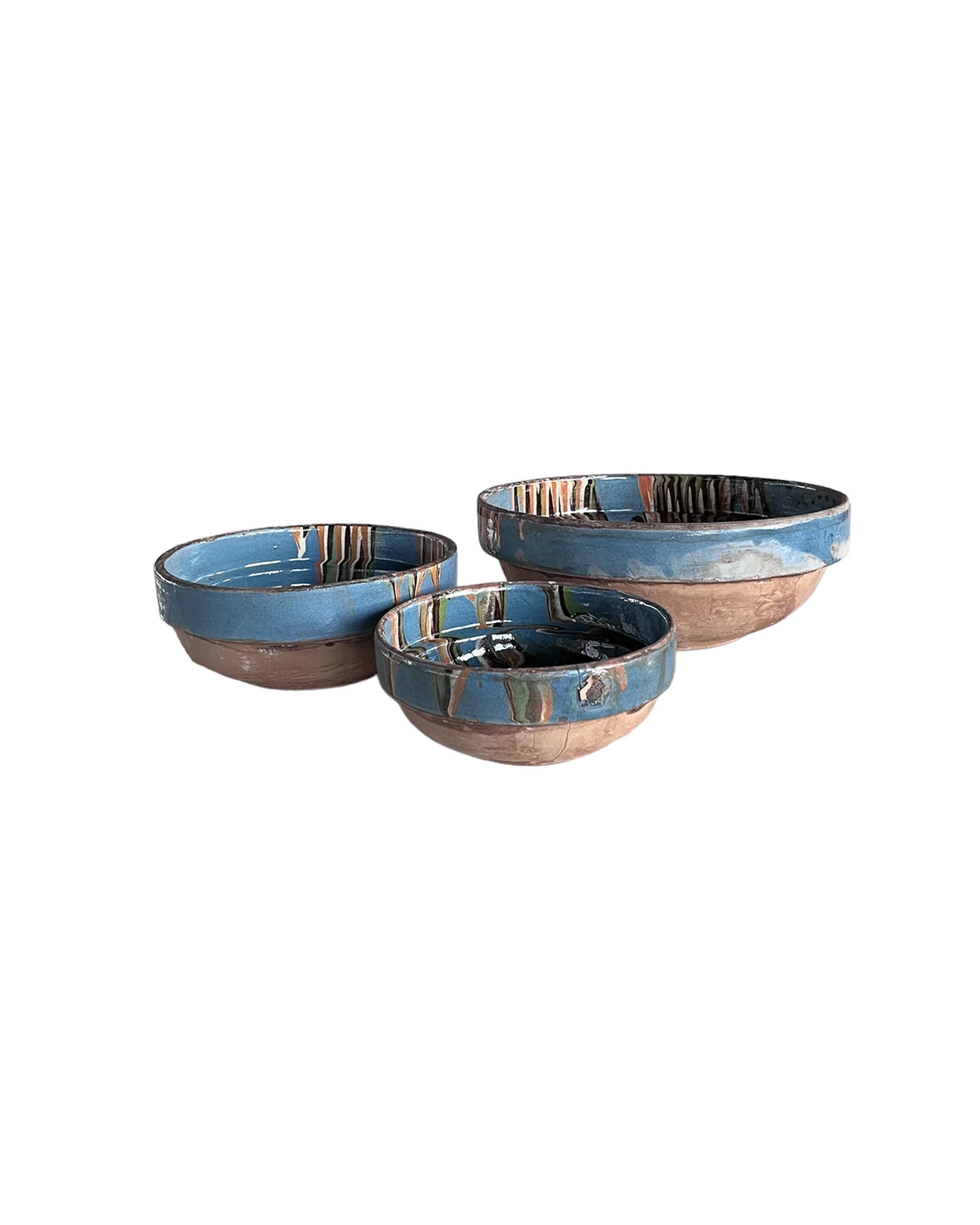 Three Blue Ocean Traders Cottage Crafted Bowls, featuring earthy brown bases and blue-glazed tops, are arranged together on a white background for a charming farmhouse accent.