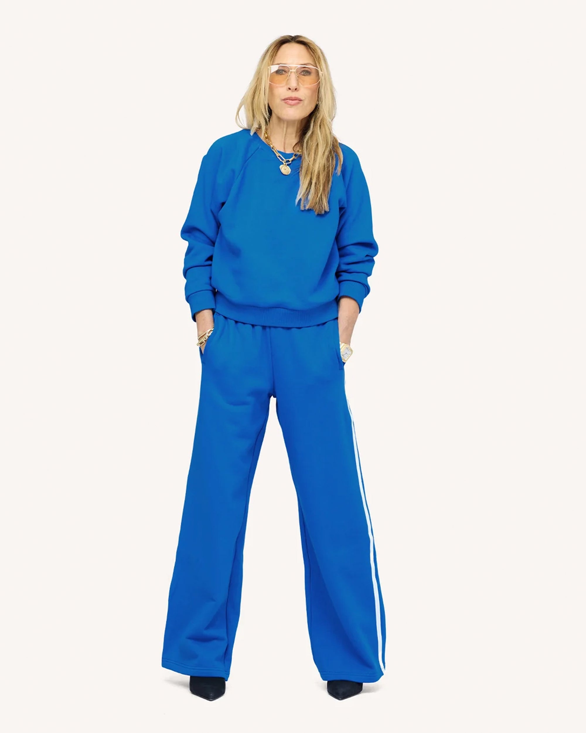 Kerri Rosenthal shrunken fleece sweatshirt in super soft fabric with wide-leg striped pants, casual chic style.