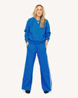 Kerri Rosenthal shrunken fleece sweatshirt in super soft fabric with wide-leg striped pants, casual chic style.