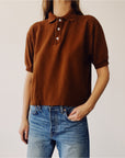 Hey Gang Boxy Polo in Cedar with blue jeans, relaxed fit, modeled against a simple light backdrop.