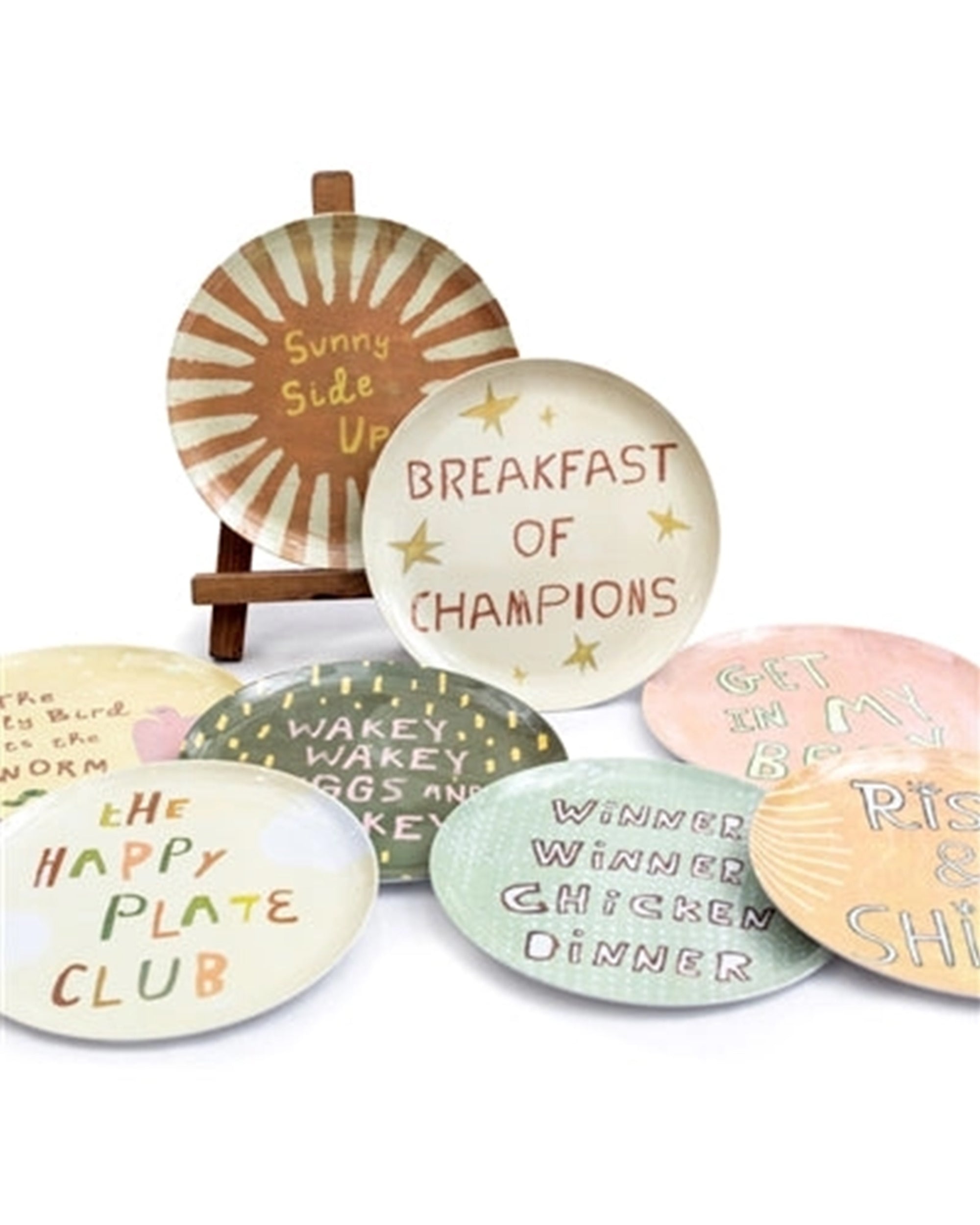 The Breakfast Club Plate Set by Sugarboo Designs features decorative plates with colorful designs and playful breakfast quotes, perfect for serving or adding a charming touch to your kitchen decor.