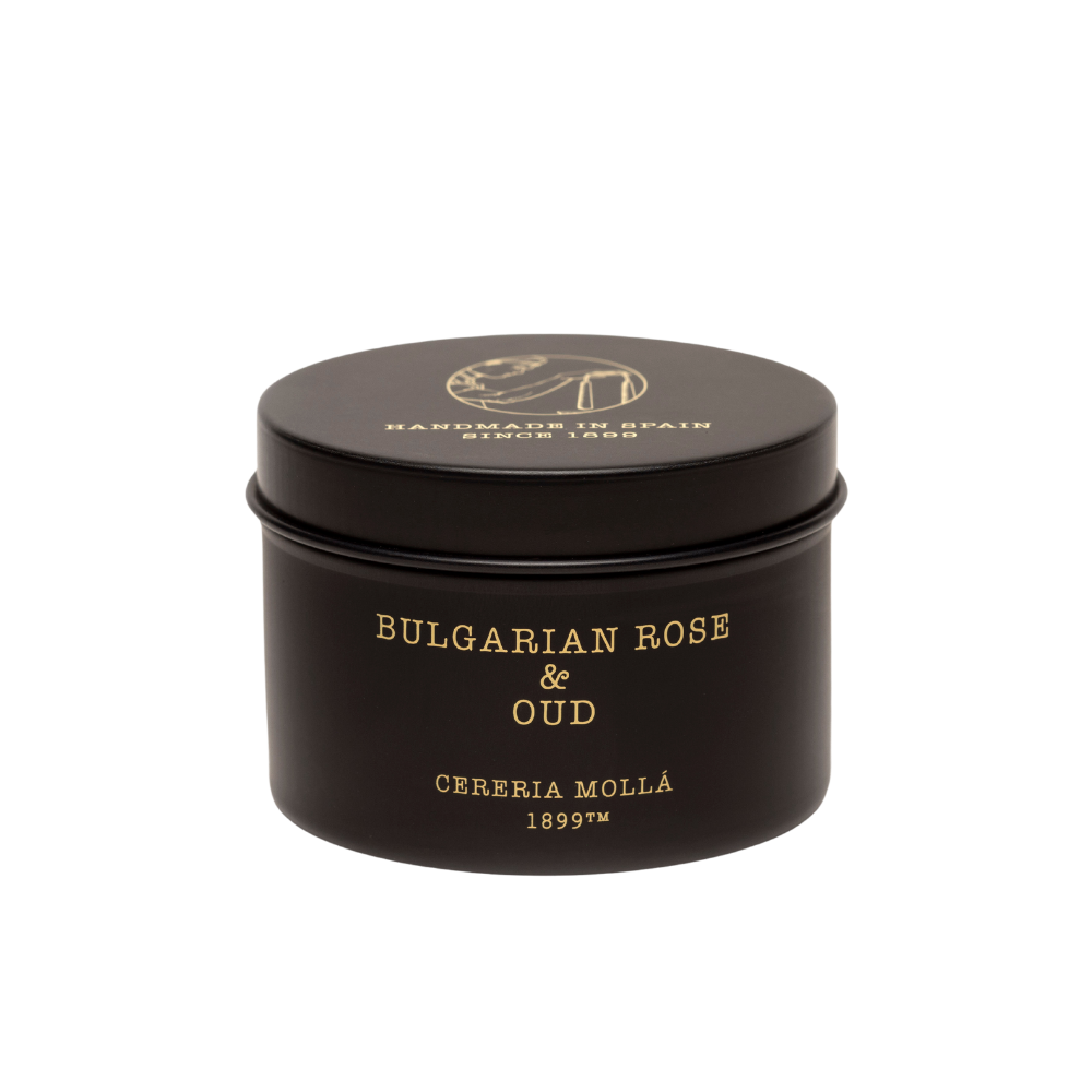 A black round tin of Cereria Molla Bulgarian Rose & Oud Candle features gold text "Cereria Molla 1899" and "Handmade in Spain" on the lid, shown against a plain white background.