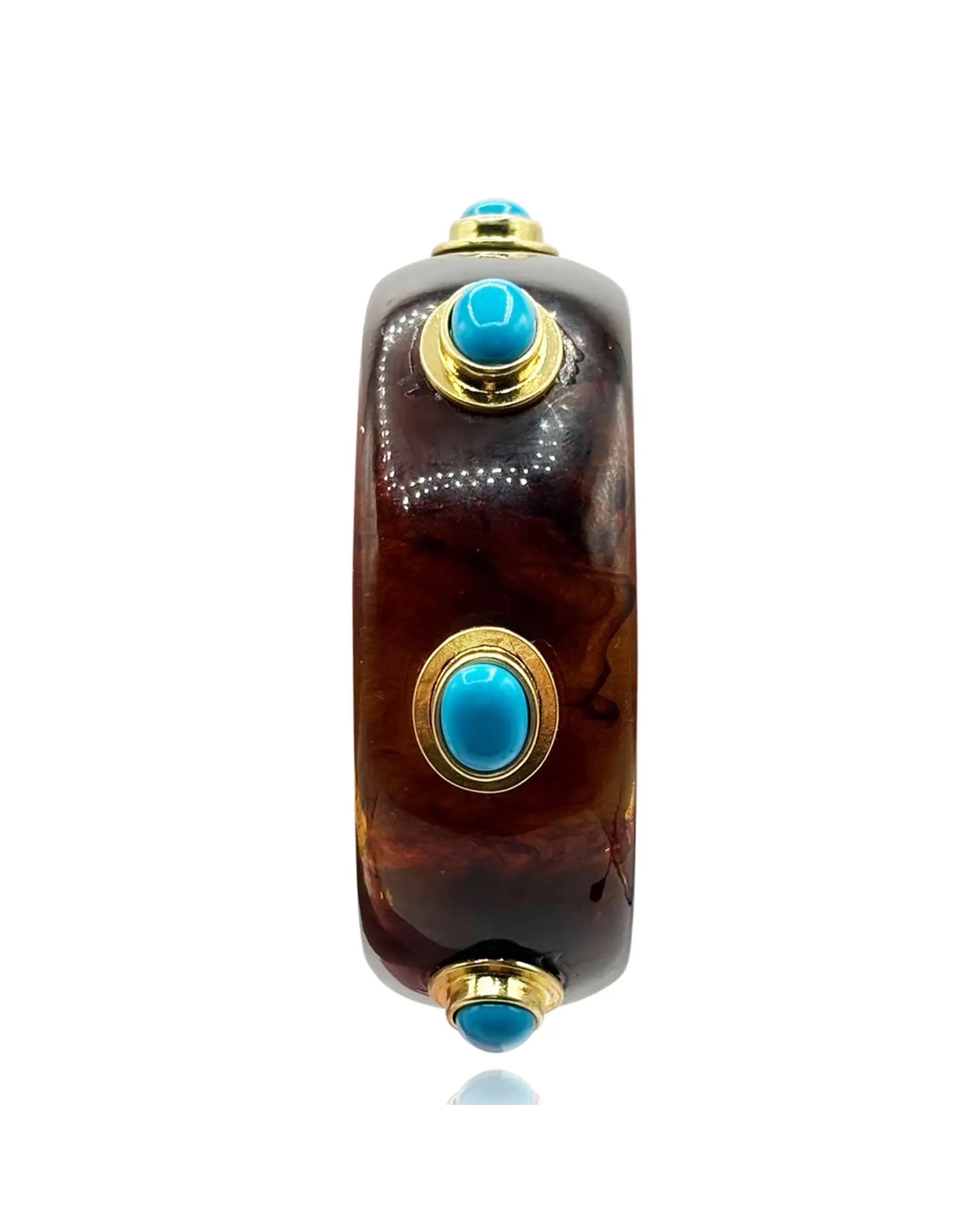 The Renee Bangle by Faire features glossy tortoise resin accented with four round turquoise stones in gold bezels, evenly spaced for a bold statement look.