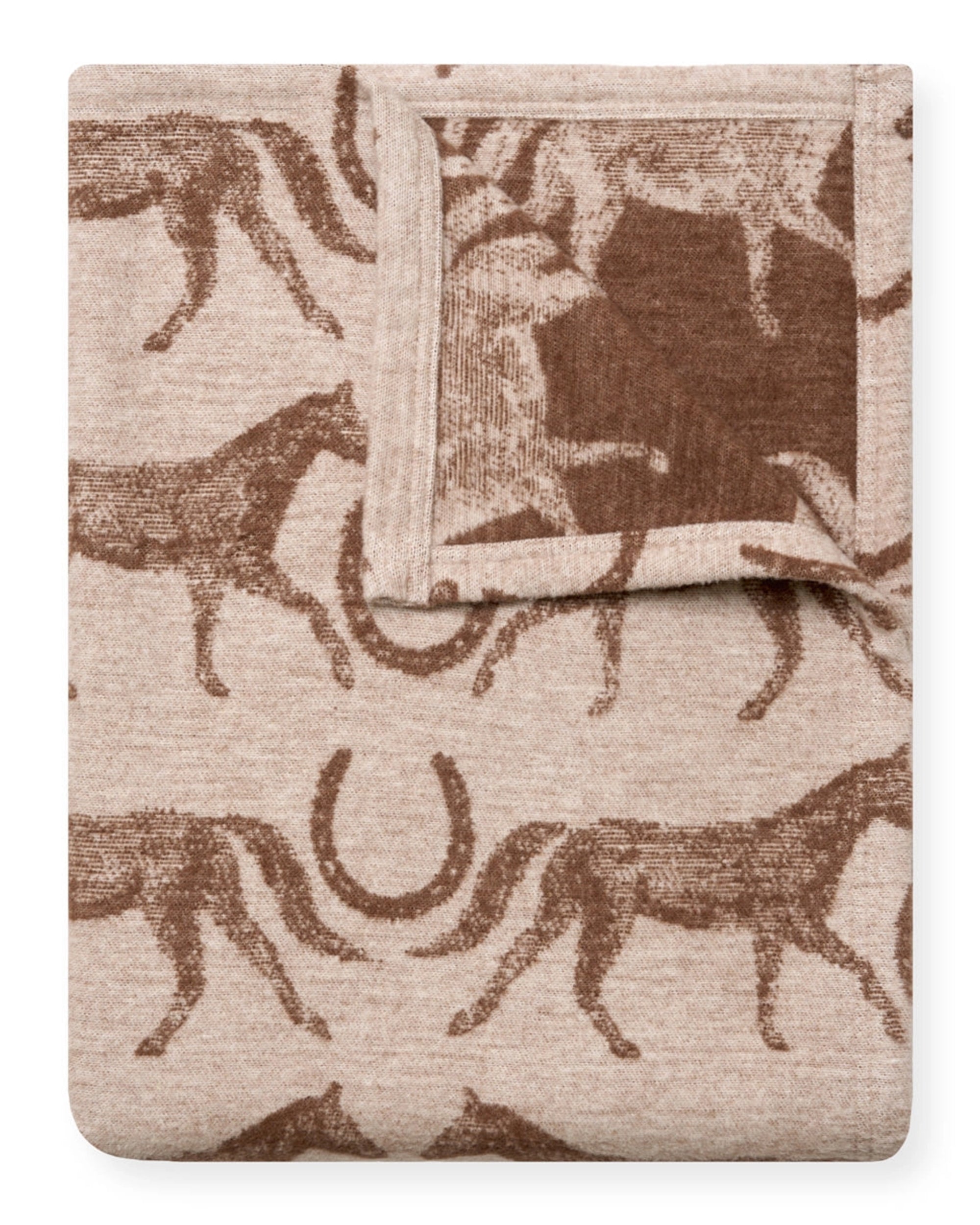 The Faire Hill Country Horses Lightweight Blanket is a portable beige throw with a brown horse and horseshoe pattern. Made from soft chappy fabric, it features a turned-over corner to reveal the reverse side of its stylish design.
