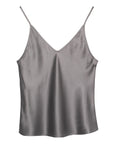 The Brazeau Tricot BT V Cami is a sleeveless, silver-gray satin camisole with a silk V-neck and thin spaghetti straps, designed for a flattering silhouette and shown against a plain white background.