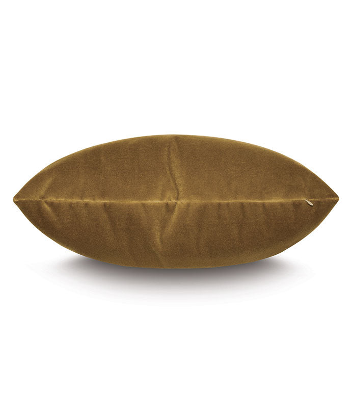 The Eastern Accents Velvet Citrine Pillow, a brown oval-shaped plush velvet cushion, is displayed horizontally against a white background with its central seam visible.