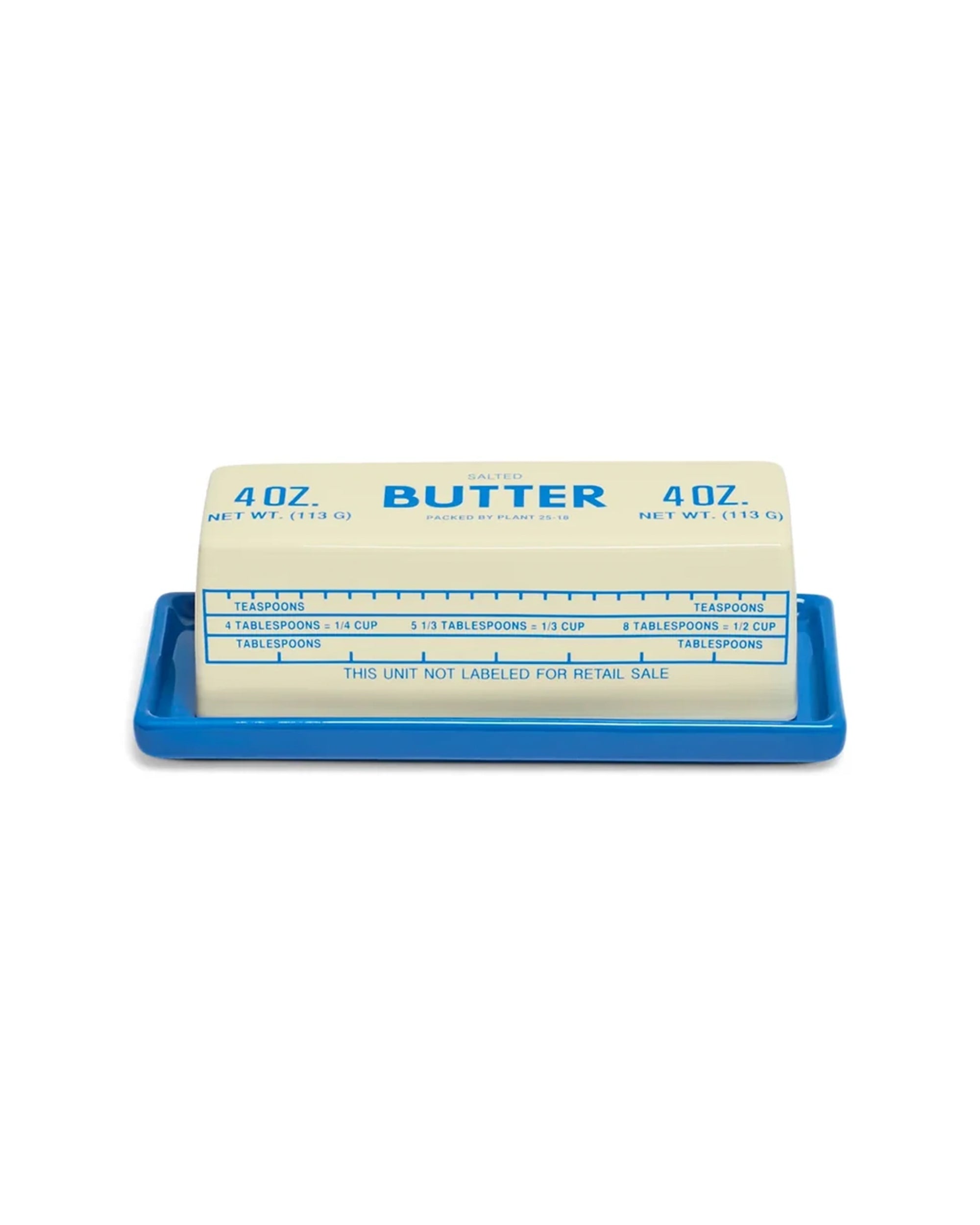 Fishes Eddy Butter Stick Butter Dish holding a stick of butter with wrapper measurement markings visible.
