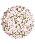 The Faire Mixed Set Reusable Small Plates feature a round, scalloped design with a pink background and a white flower and green leaf pattern—ideal for adding Liberty charm to your table.