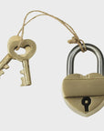 The HomArt Heart Lock Brass is a solid brass lock with two matching keys featuring heart-shaped cutouts, tied to the padlock with twine, ideal for wedding party favors.