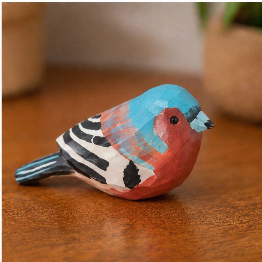 Hand-painted blue carved wood bird by The Faire, adding vivid rustic charm to any tabletop or shelf décor.